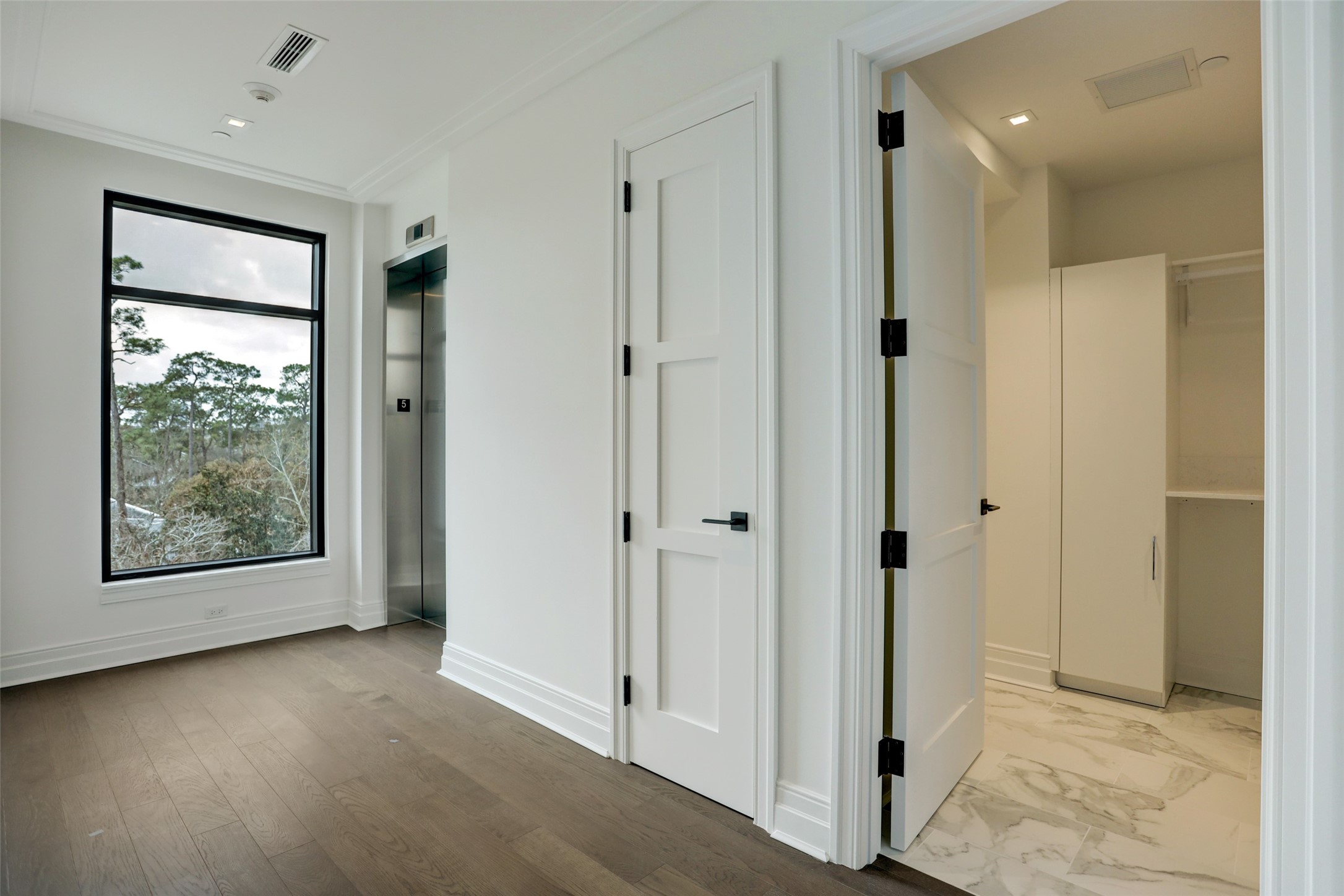 View of the private elevator and large utility room (washer and dryer included)