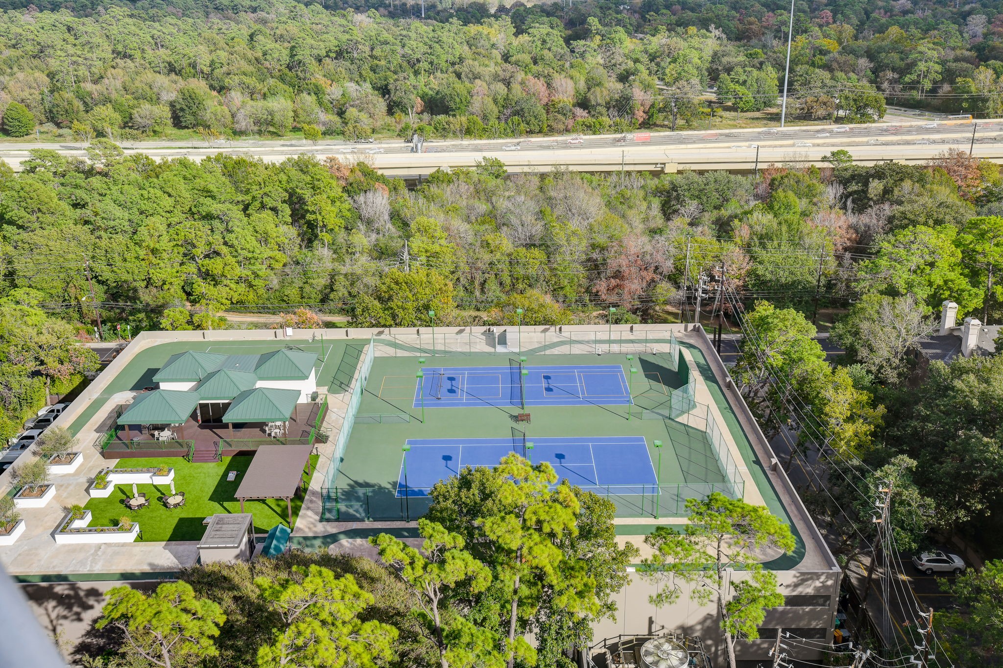 View of tennis courts from one of your private balconies
