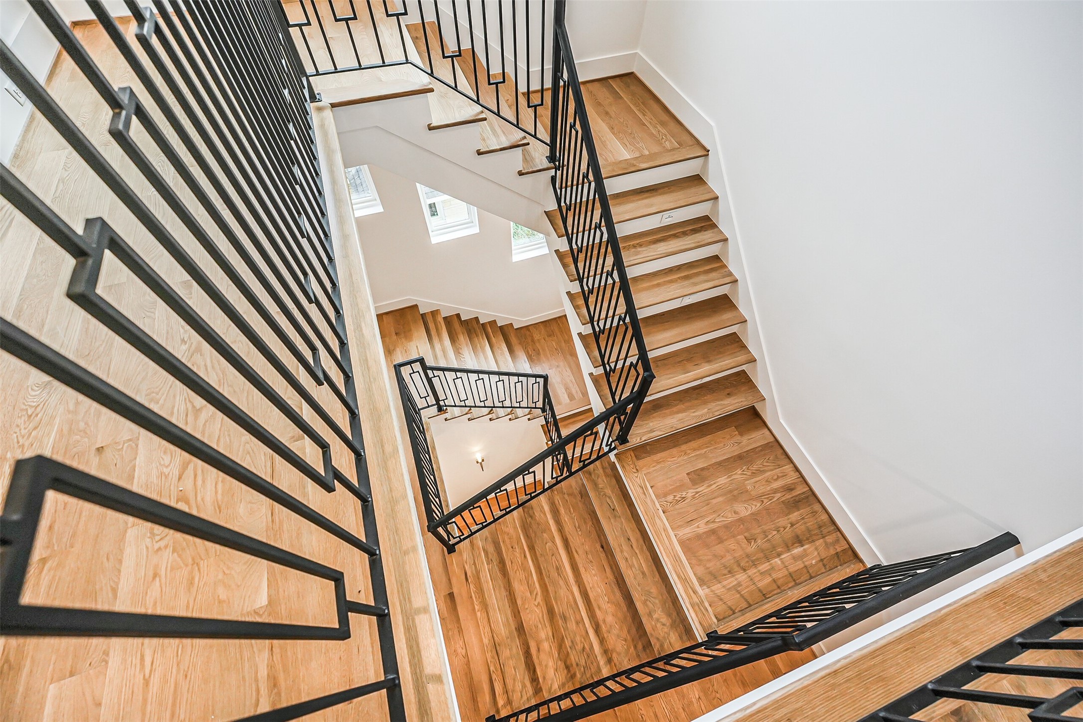 Images of the stair case from a similar home built by the same builder in 2023.