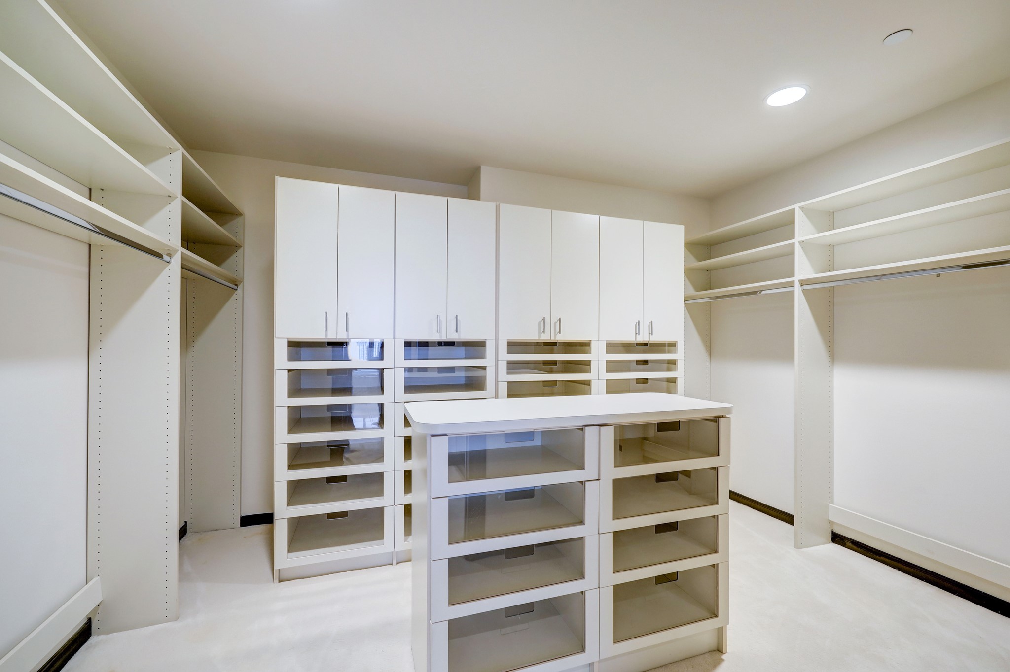 The Primary Walk-in Closet provides hanging and storage space for clothes and accessories of all types and sizes.