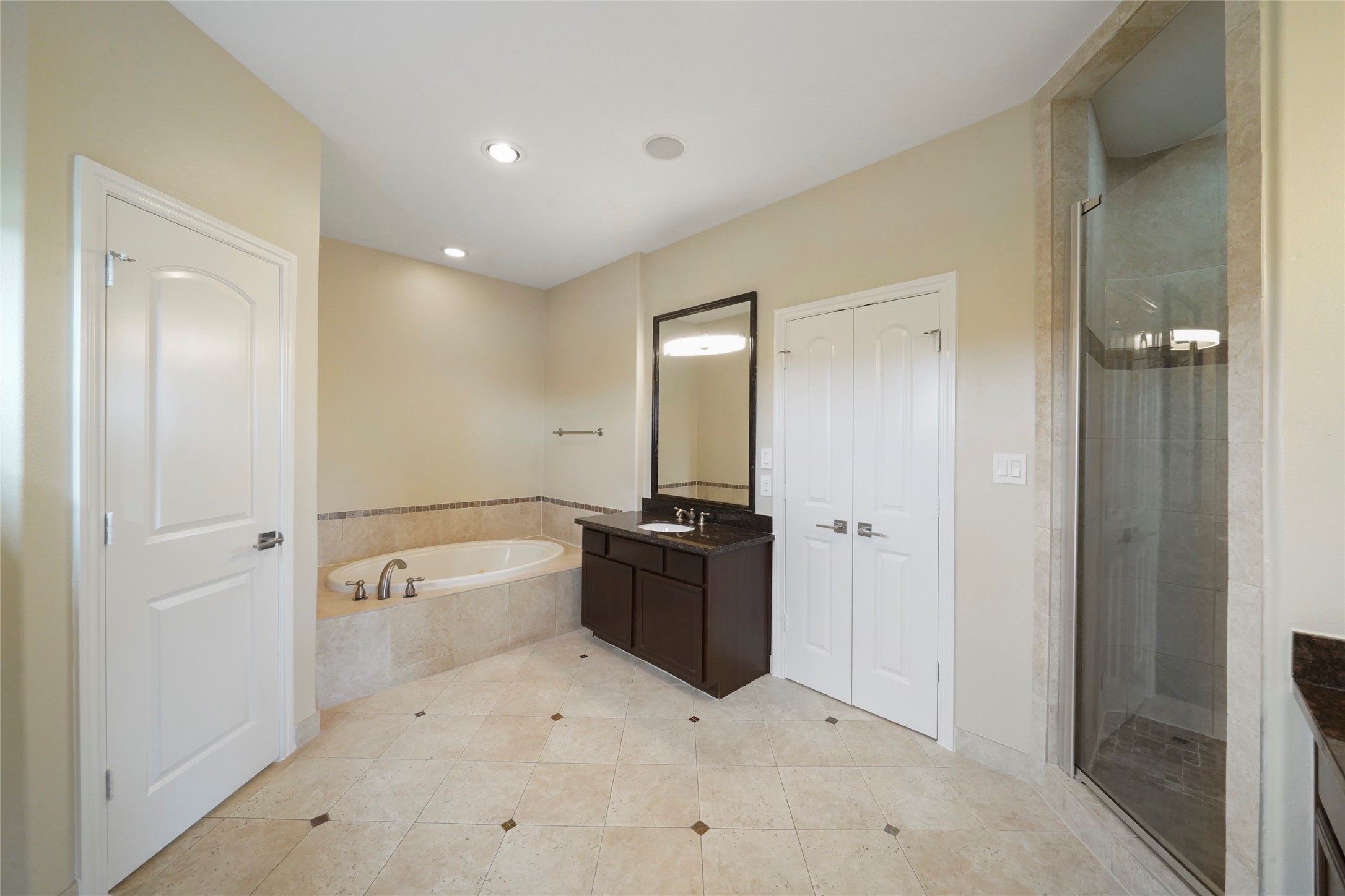 The primary bathroom with separate water closet for privacy.