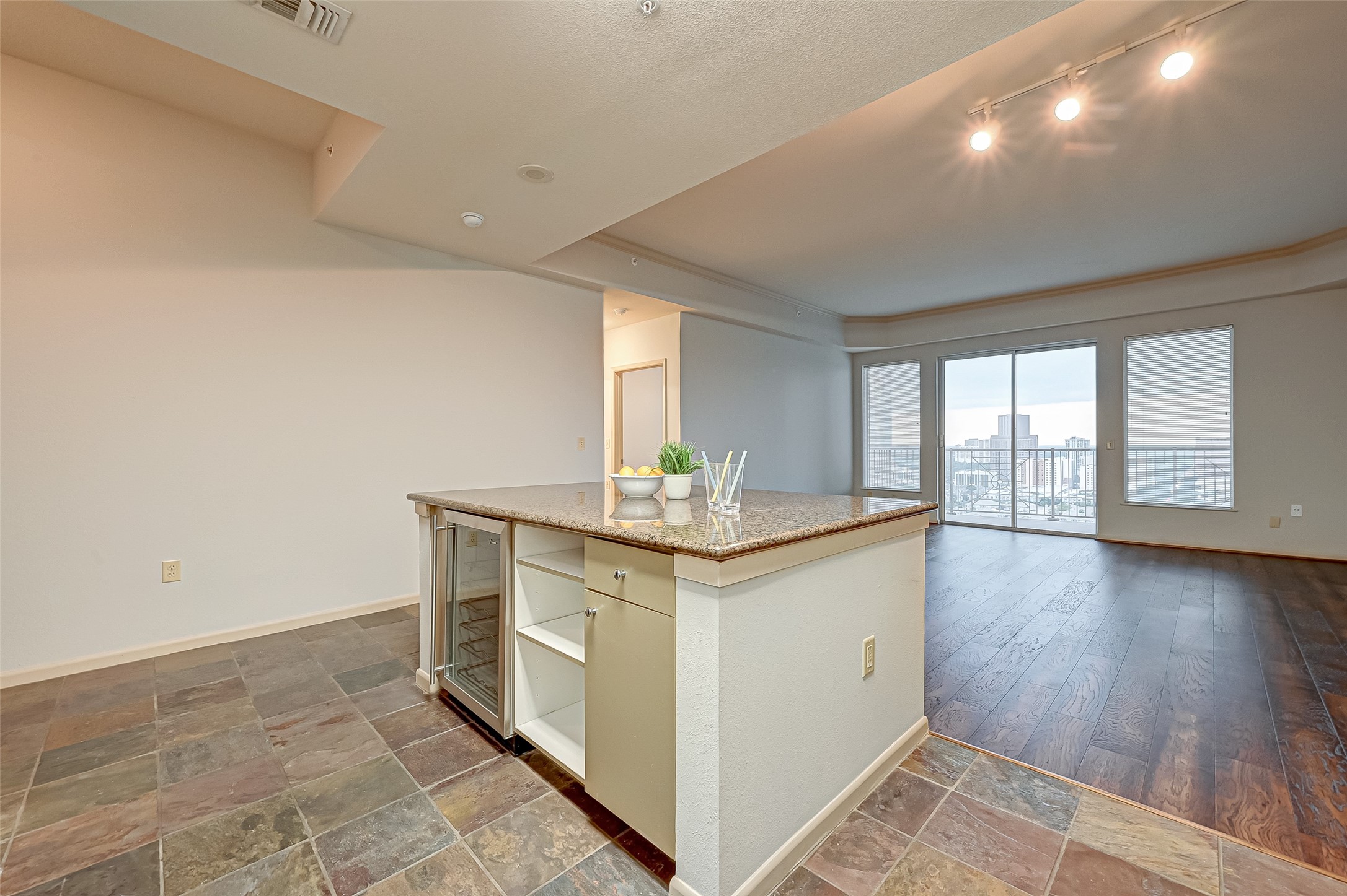 The kitchen is open to the family room. Double glass doors lead you to the balcony.