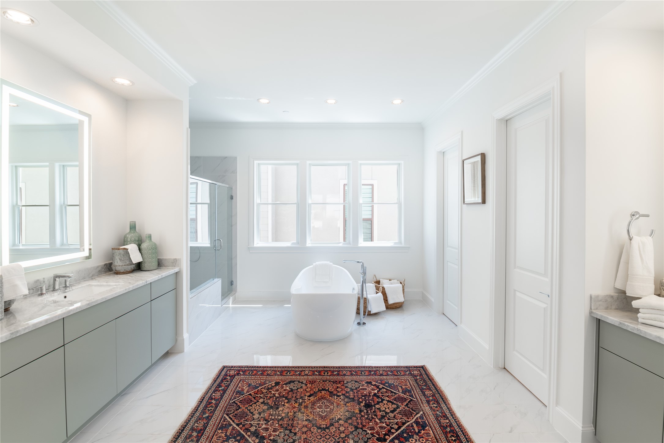 Clean finishes, a luxurious freestanding soaking tub and an oversized shower with bench are sure to soothe your soul.
