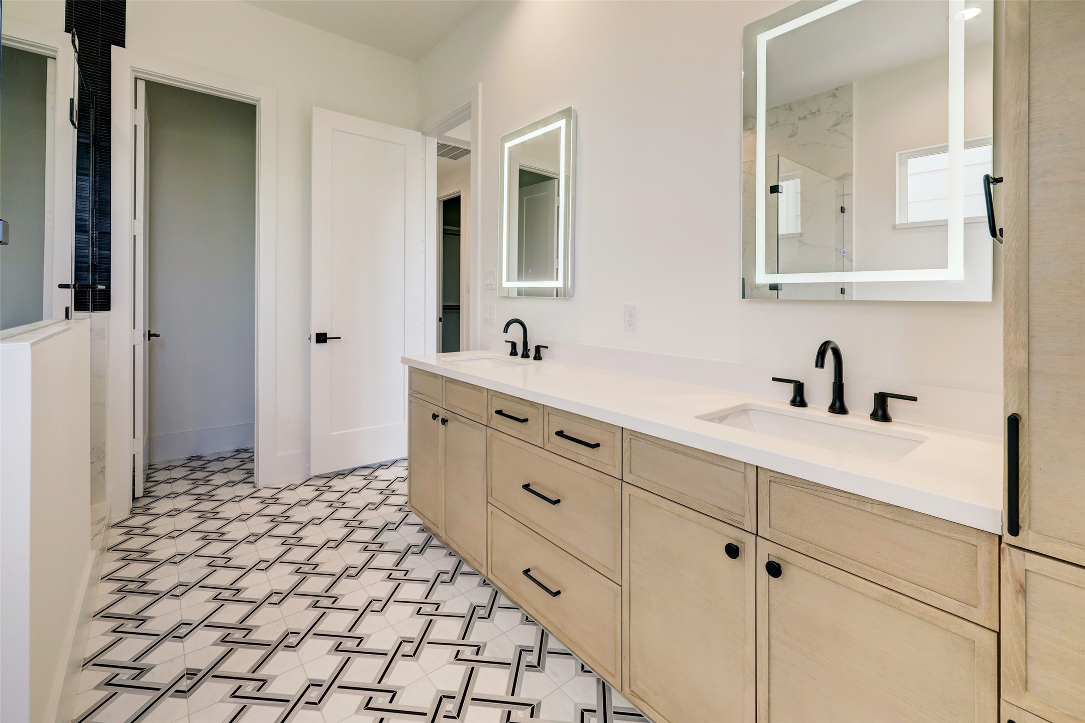 Enter into a jaw draw dropping primary bath retreat. His & her sinks, freestanding tub, oversized standalone shower lined with tile detail. Note 5307 tile will be slightly different upon completion.