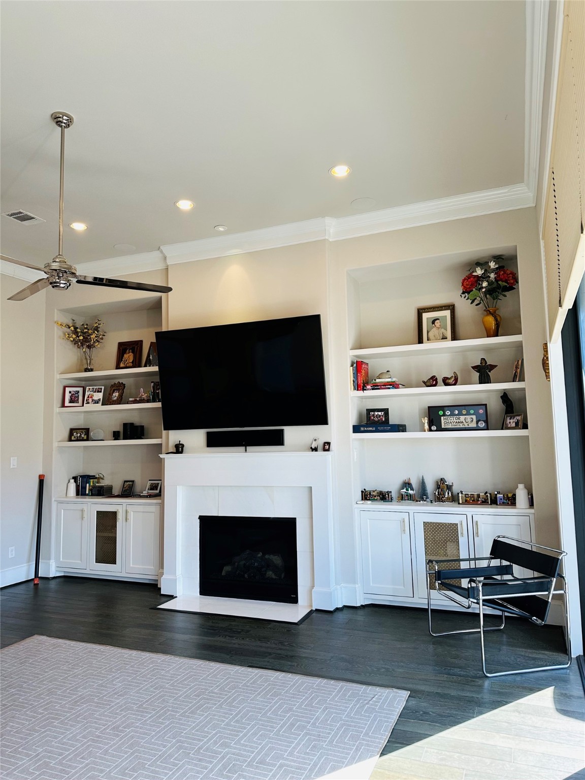 Custom built ins, gas fireplace, surround sound for family movie nights.
