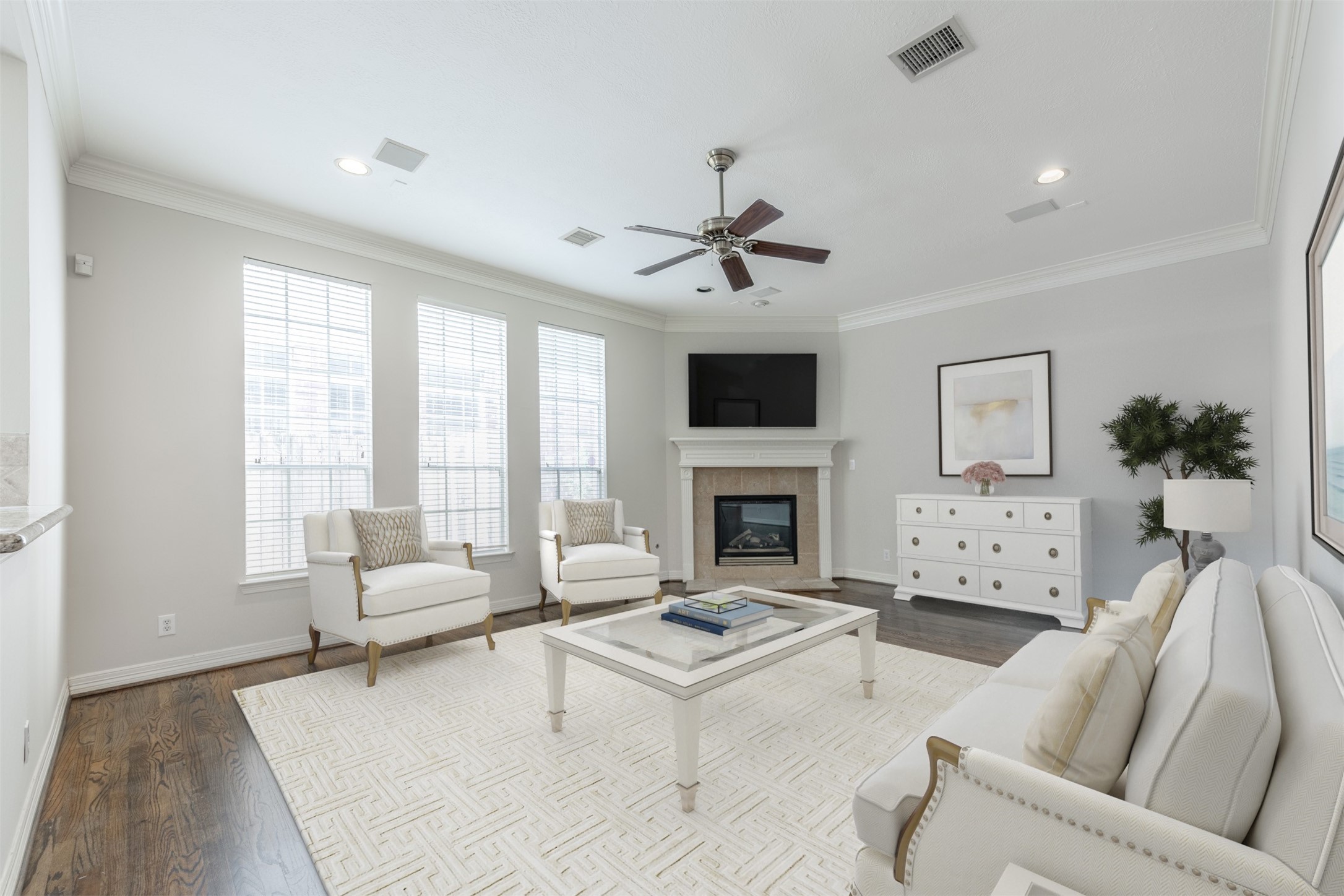 This inviting family room provides a lovely gathering place for your family and friends! Featuring high ceilings, wood flooring, fireplace & mantel and wall of windows bringing in lots of natural light! *virtually stage