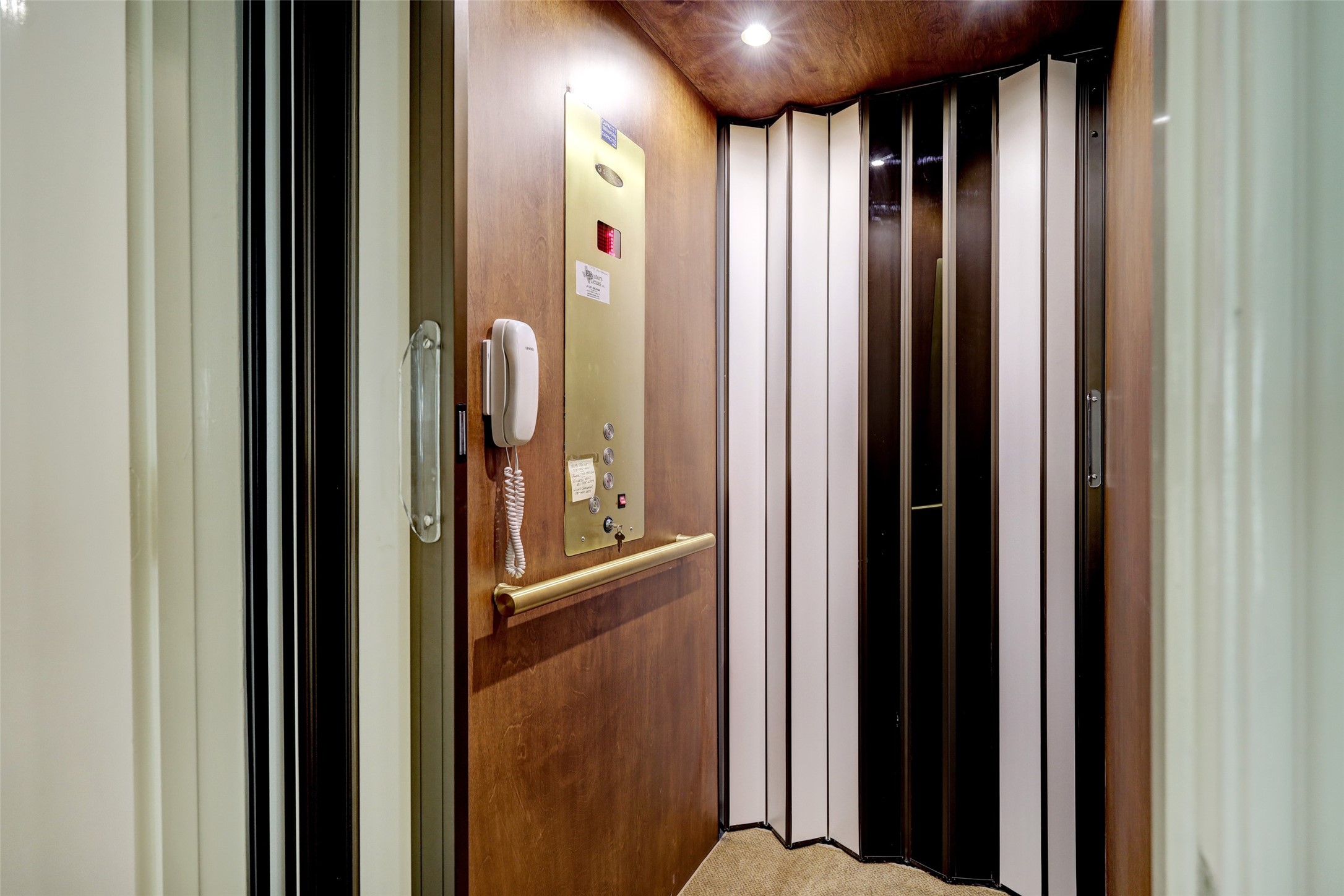 Nestled discreetly off the kitchen, a handsome elevator adds convenience and accessibility to the home's design.
