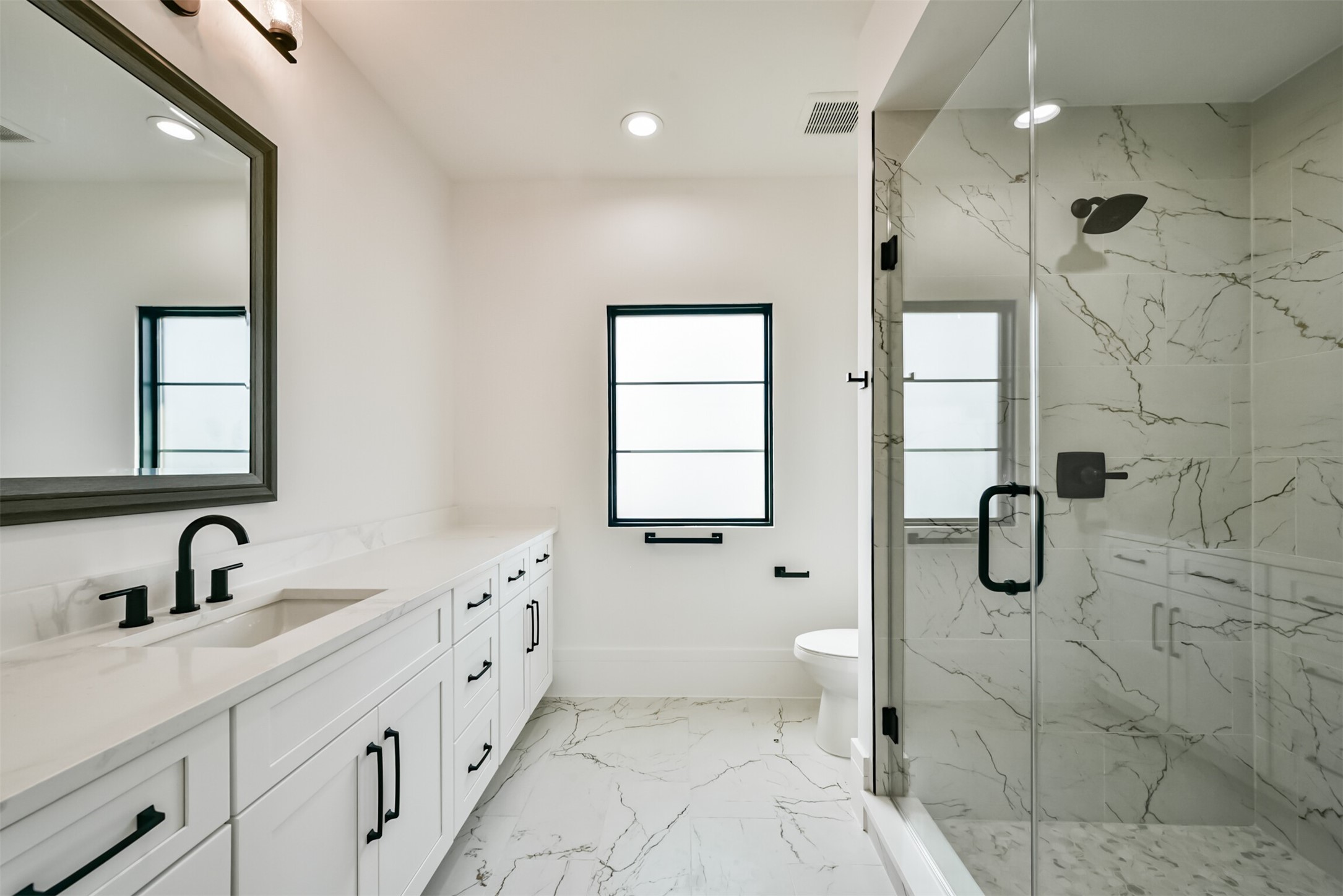 3rd Floor Bathroom featuring Frameless Shower