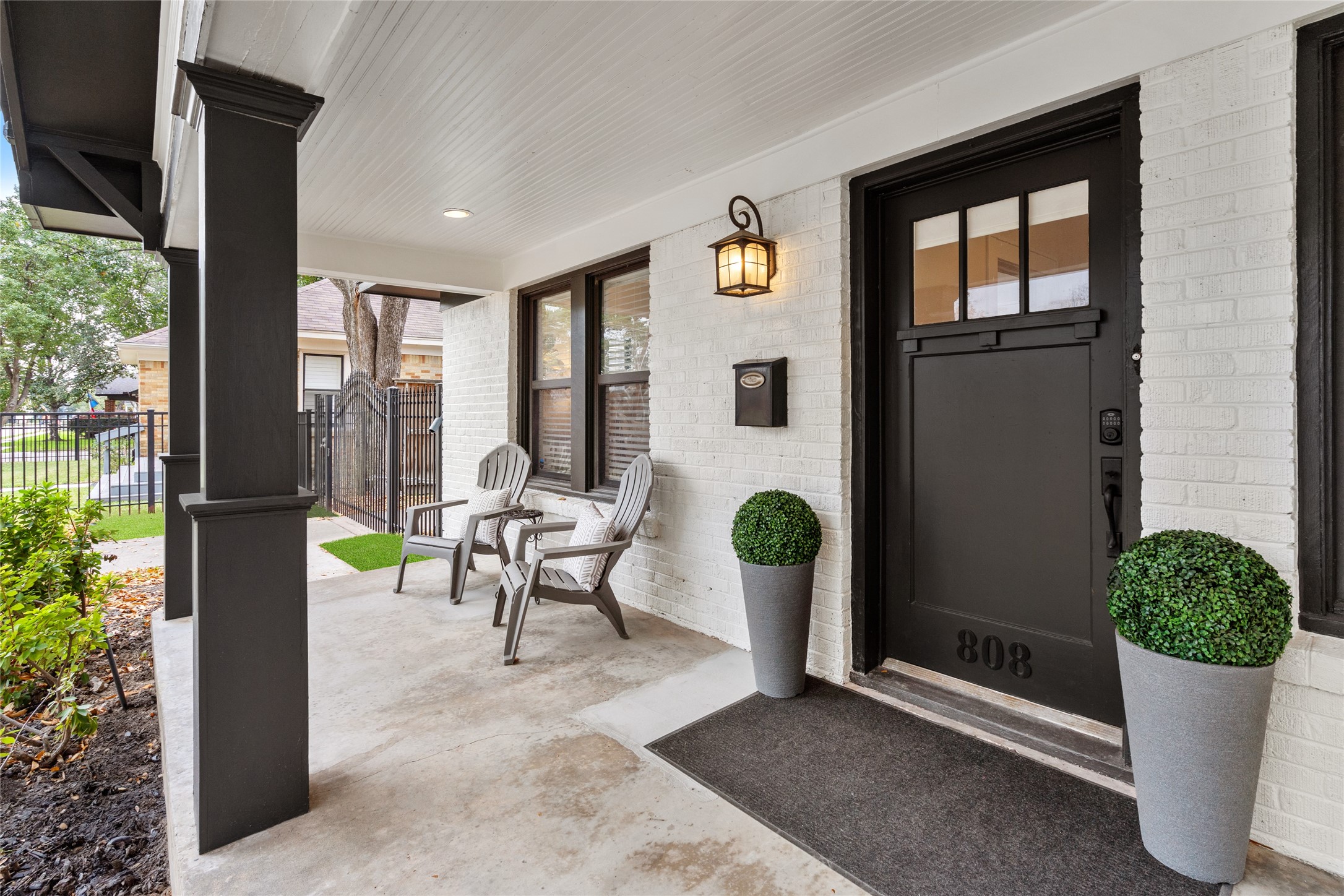 The front porch is  inviting and calling all to sit and enjoy the neighborhood.