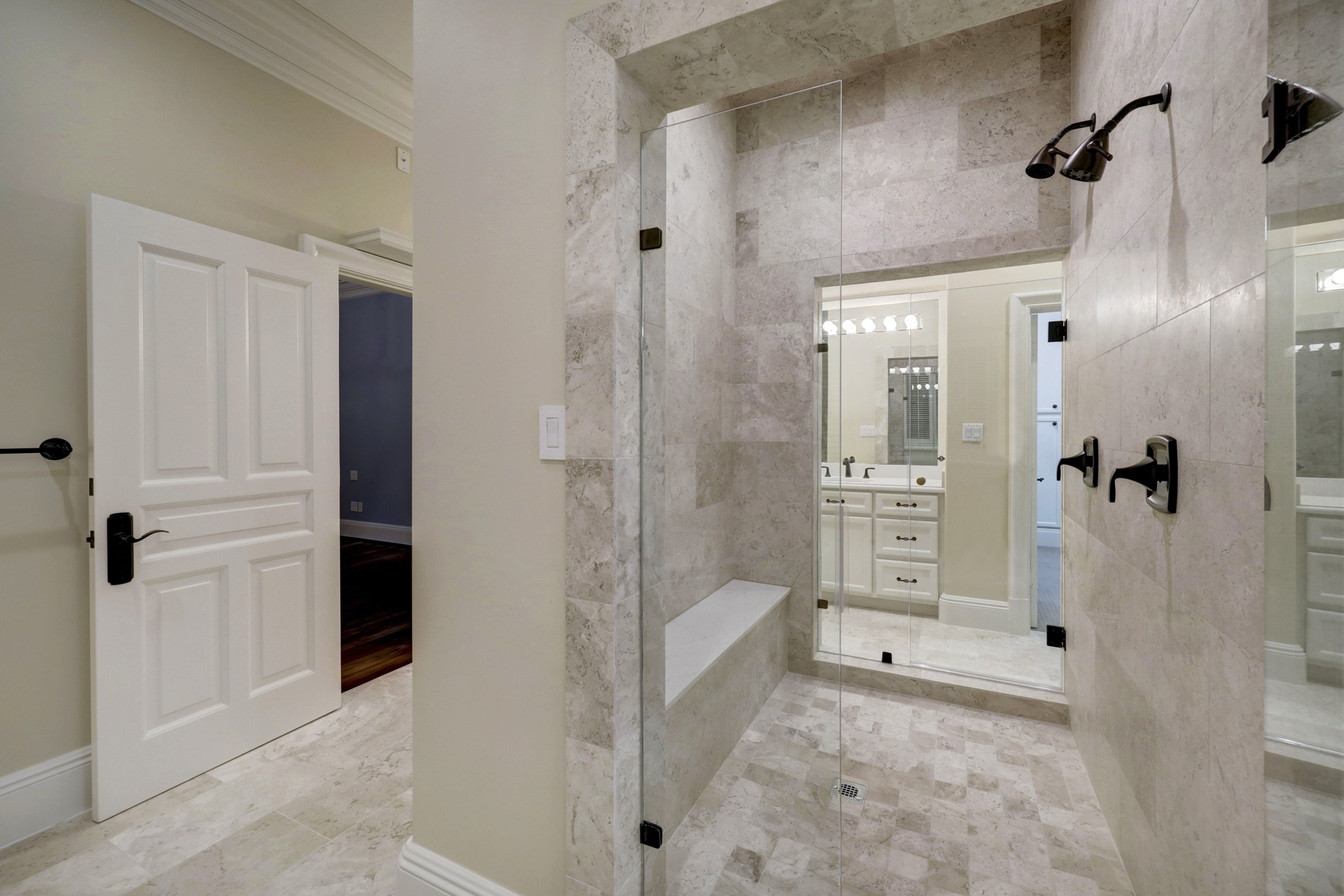 The shower has entrances from each of the full baths.  Two vanities, two private water closets, two large walk in closets, one shower with dual entries, one tub and one home office to complete the space.  Exceptional in every way!