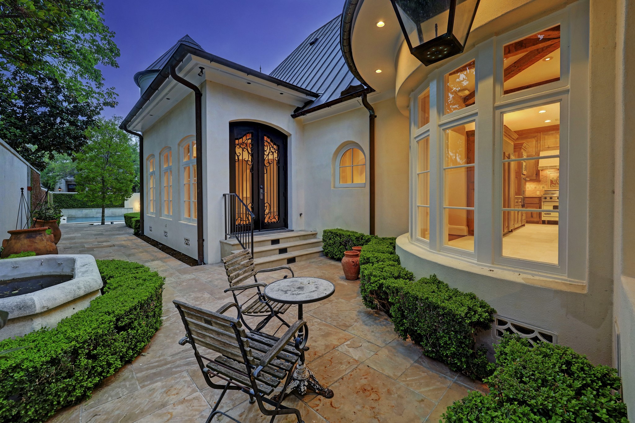 This charming patio is accessed from the Dining Room, the Breakfast Room or even by waking around from the front patio with the swimming pool and the fire pit.