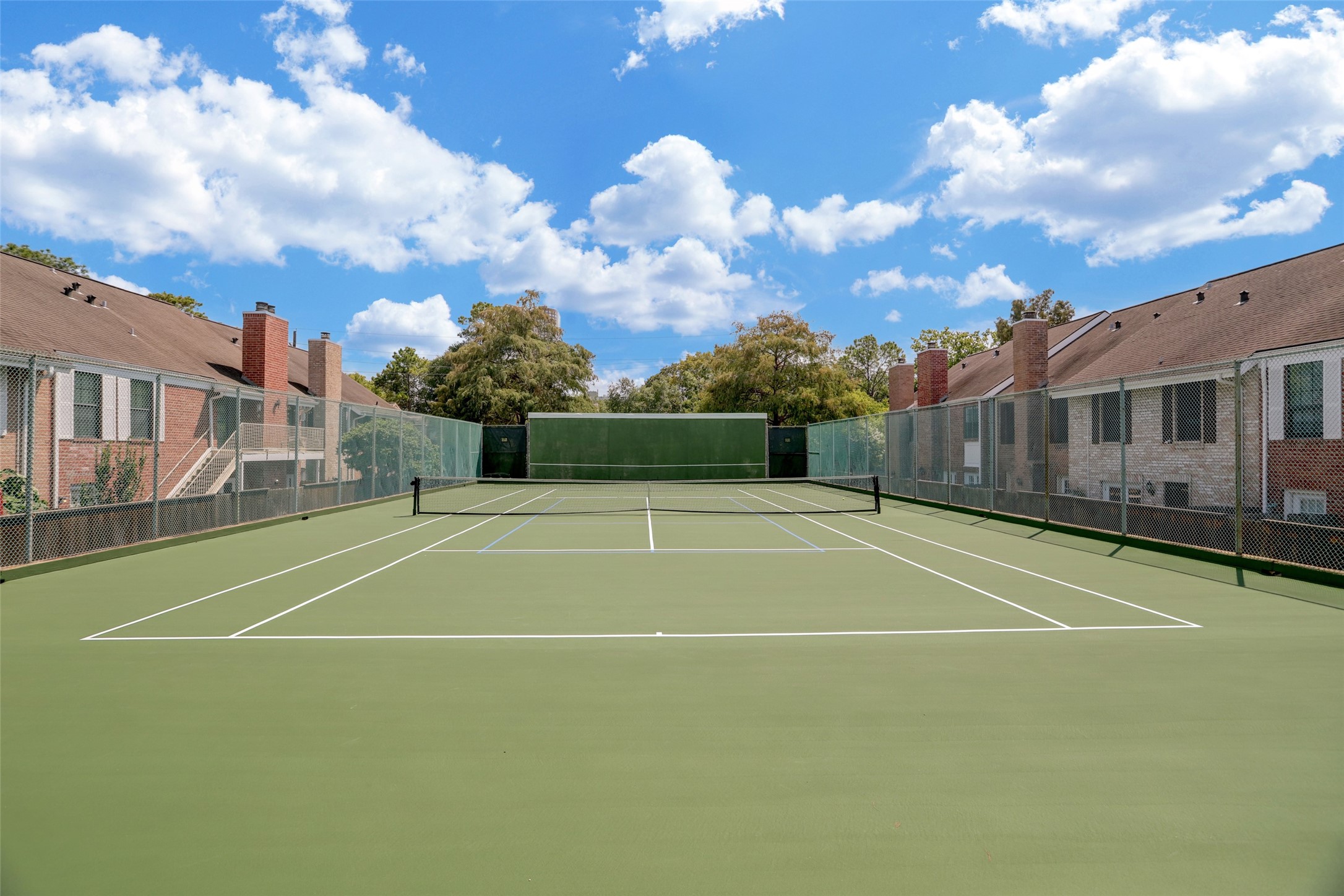 Woodway Point, a sought-after destination, boasts a state-of-the-art pickle balland tennis court that serves as the perfect post-work playtime venue.