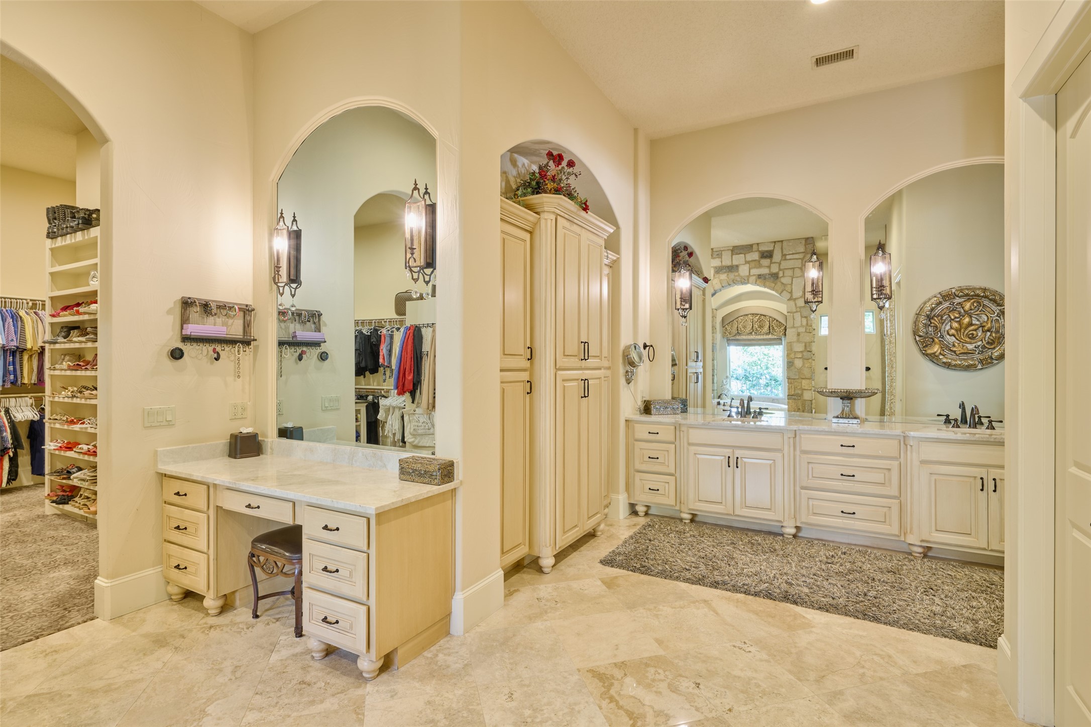 Luxurious master bath with dual sinks, separate vanity area, TV behind mirror (is a must-see!), remote control gas fireplace, remote window shades, polished travertine marble, Toto Neorest Bidet (included) the 'Bentley' of bidet systems