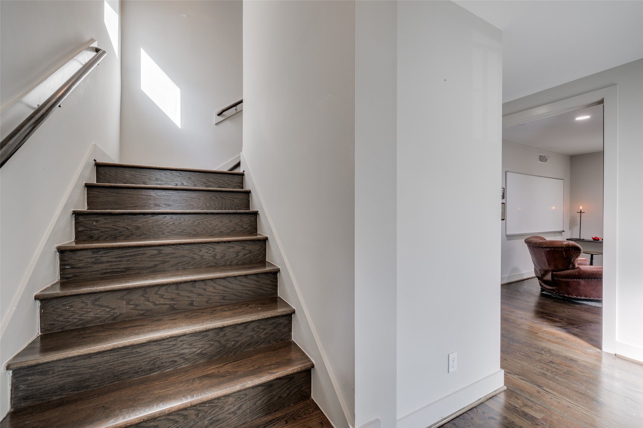 Upstairs to living room on these beautiful hardwood stairs