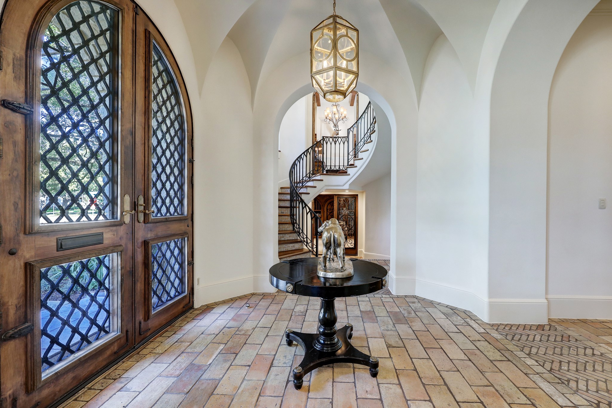 The main stairwell serves as a focal point and provides convenient access to the study and upstairs gallery. The stairwell is adorned with clerestory windows, which allow natural light to flood the space, creating a bright and welcoming atmosphere.