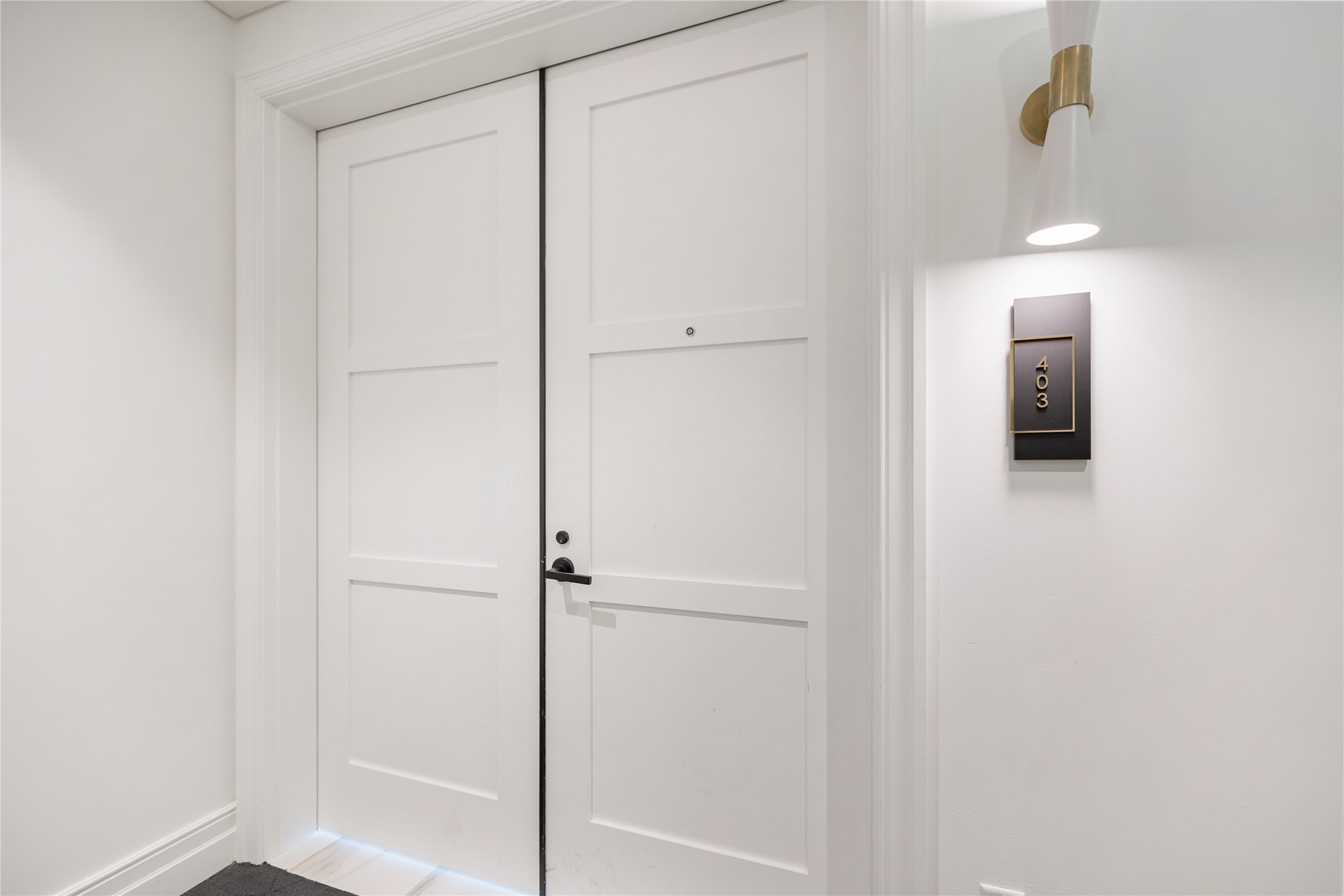 Residence 403 has easy access to elevator. What a grand double entrance.