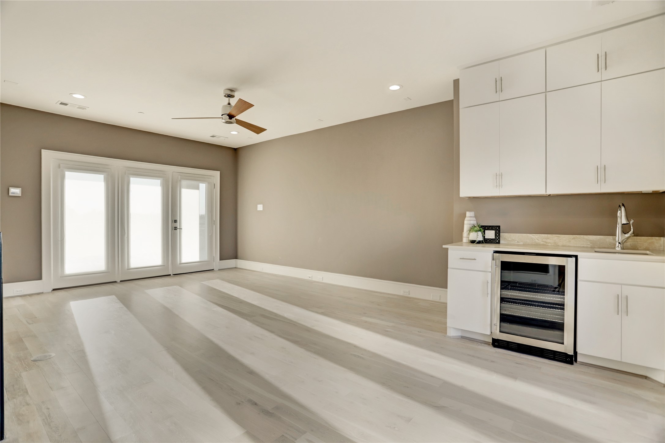 The forth floor offers an expansive flex/game room space and includes a gorgeous wet bar.