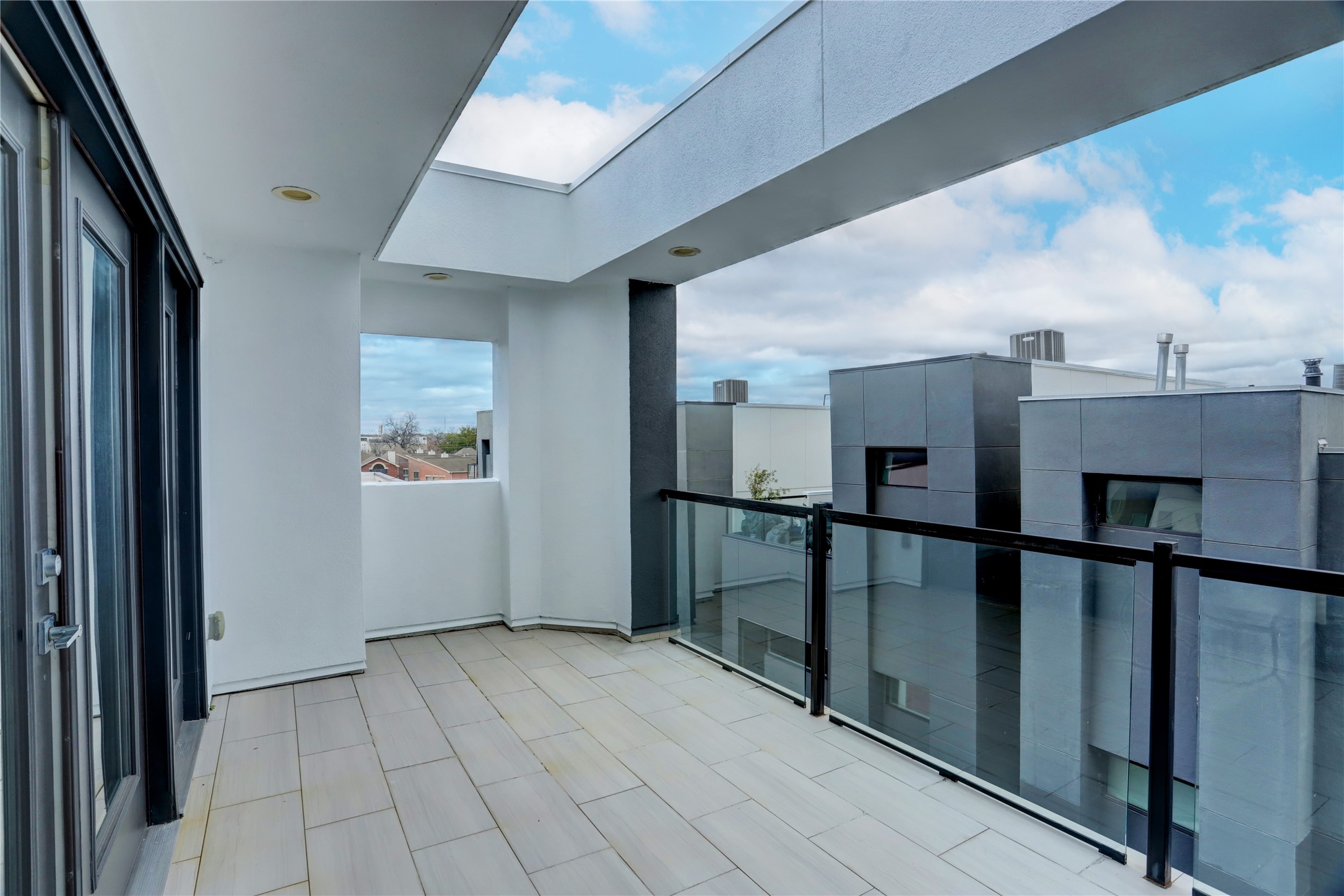 One of two the TWO rooftop terraces welcomes you to enjoy city views and fresh air is a serene setting. With a partially open ceiling you can sit outside and see the stars.