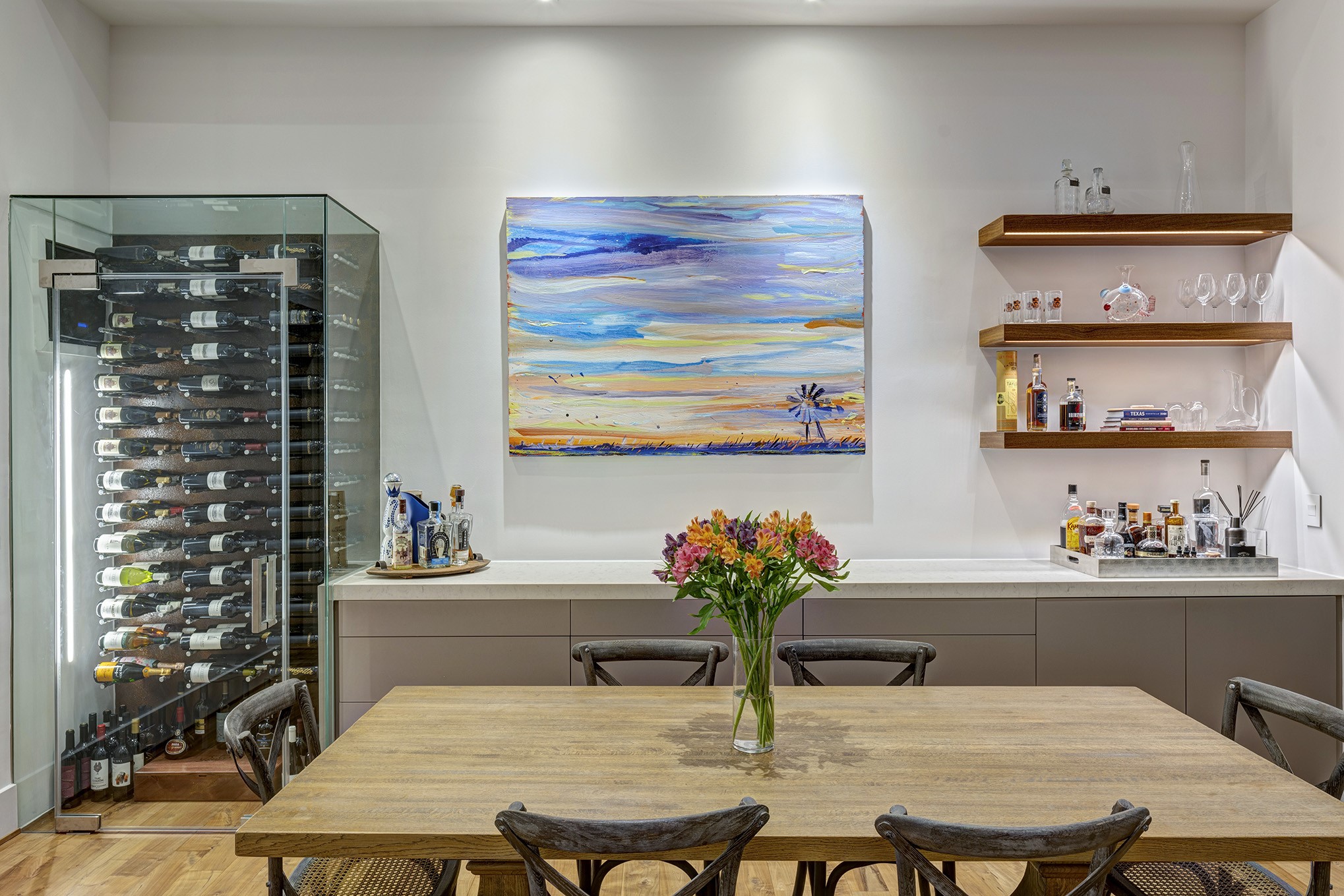 Entertain in style! Dining area off the kitchen is ideal for large gatherings. The 125+ glass enclosed wine closet has it's own air-conditioned unit.