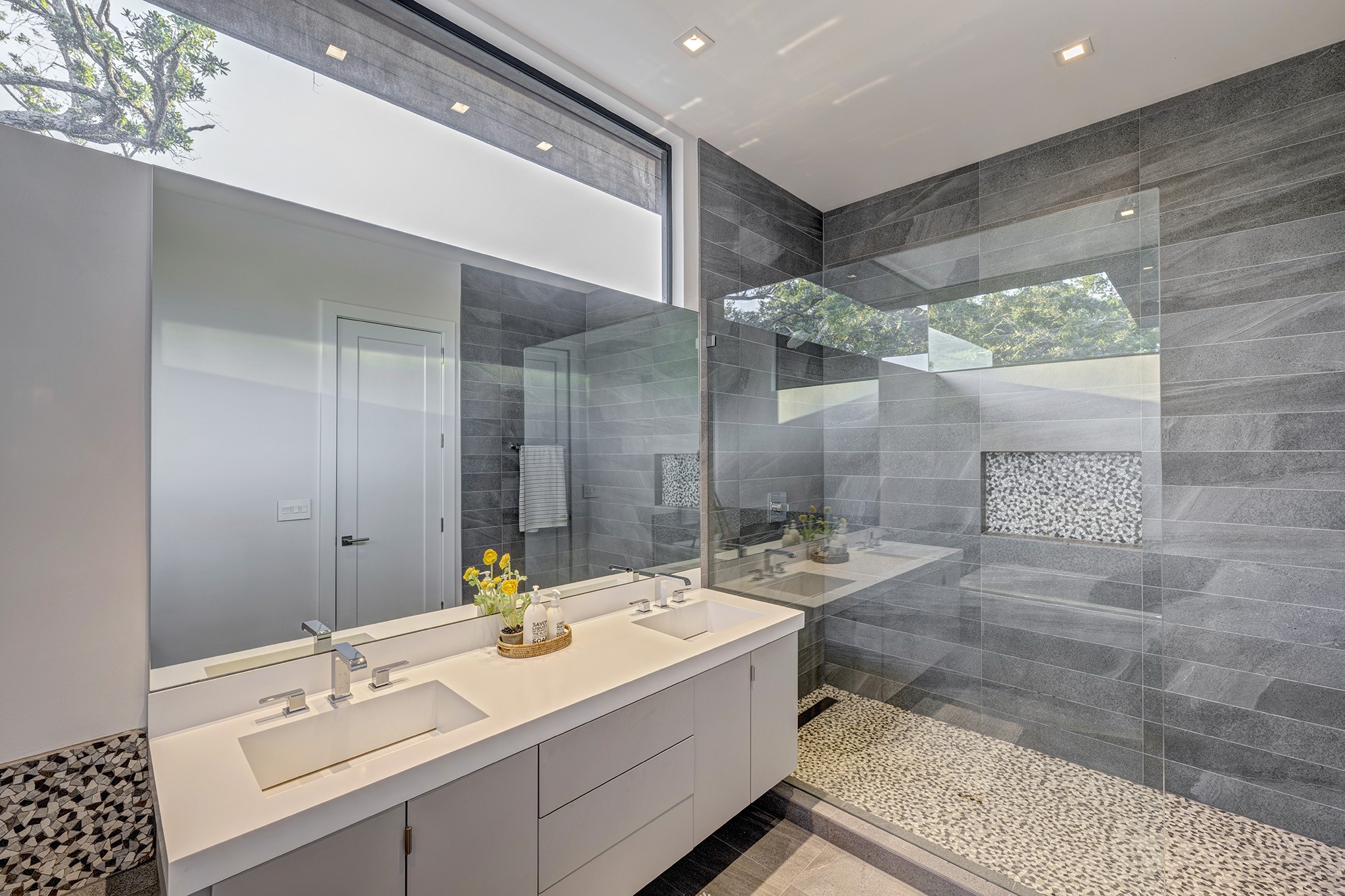 Walk-in shower for the hallway bathroom. The water closet is outside this room for added privacy. Owners saw this design in Australia and incorporated into the home.