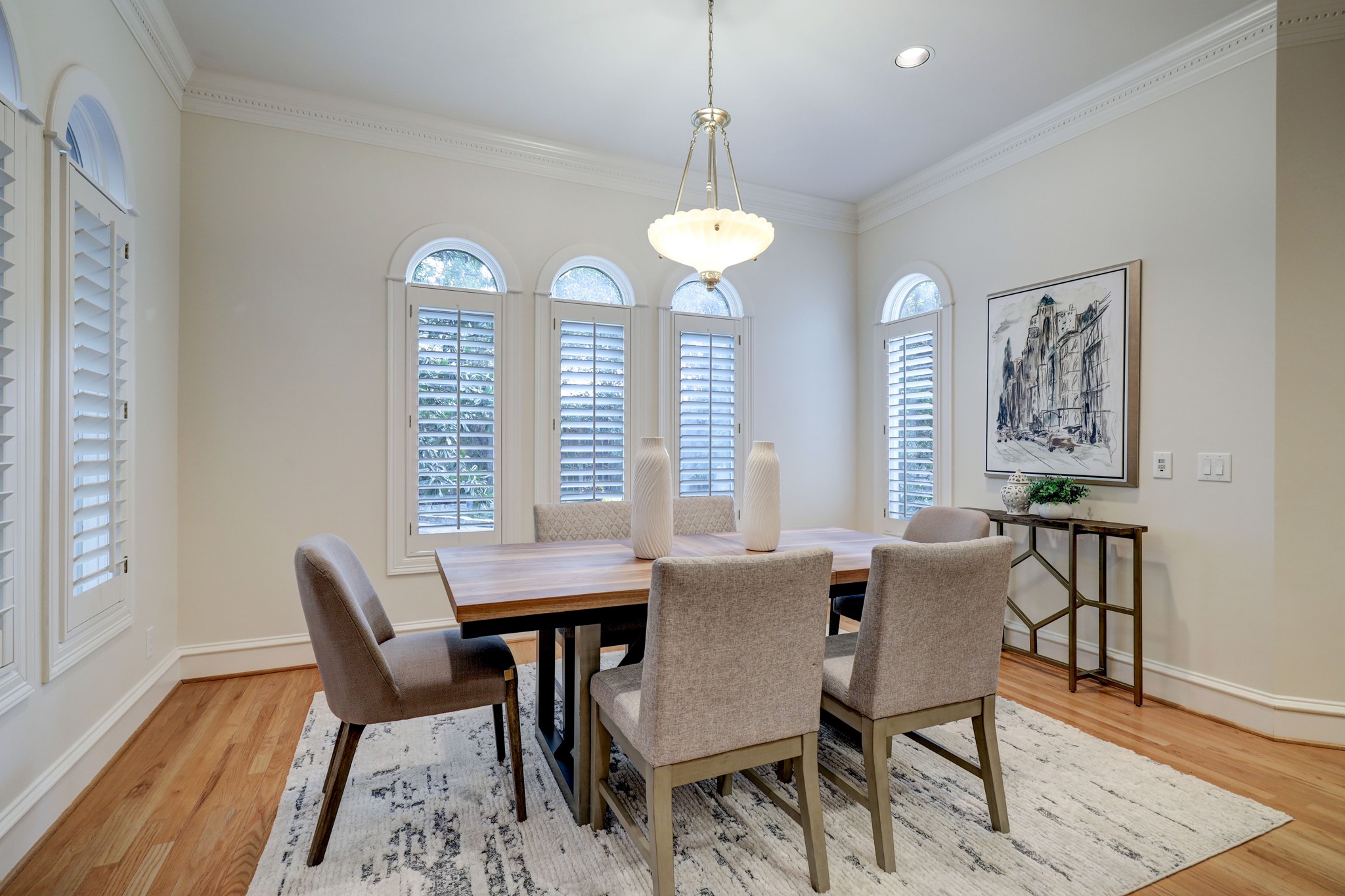 Immediately adjoining the kitchen is this handsome breakfast area for informal dining.  Like much of the home, it has beautiful views of the front garden area.