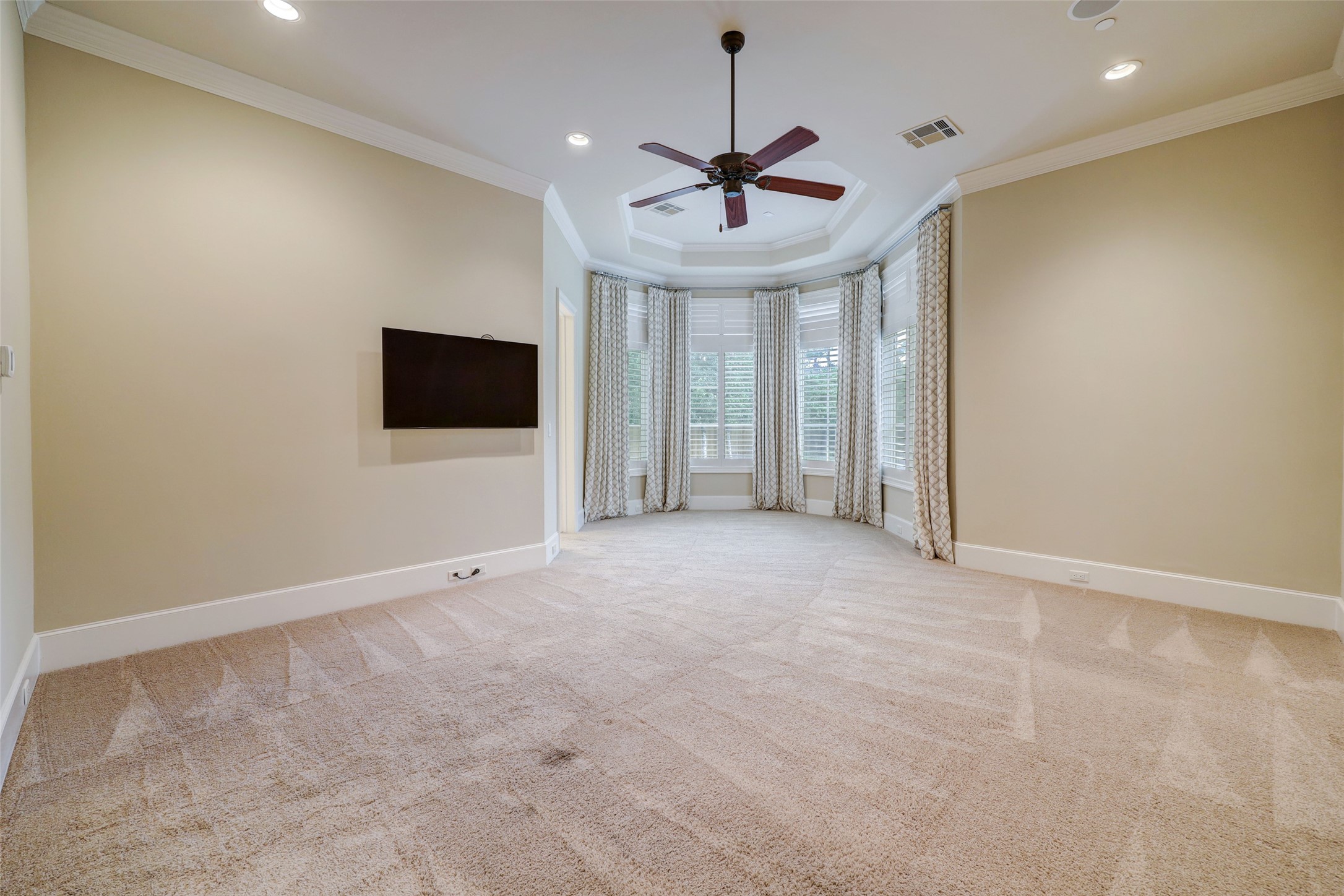 Features within the Master Suite are double crown moulding, a cove ceiling, and surround sound.  The Master wing also has its own thermostat for your sleeping comfort. A bay of windows allows you to view the world you left behind outside.