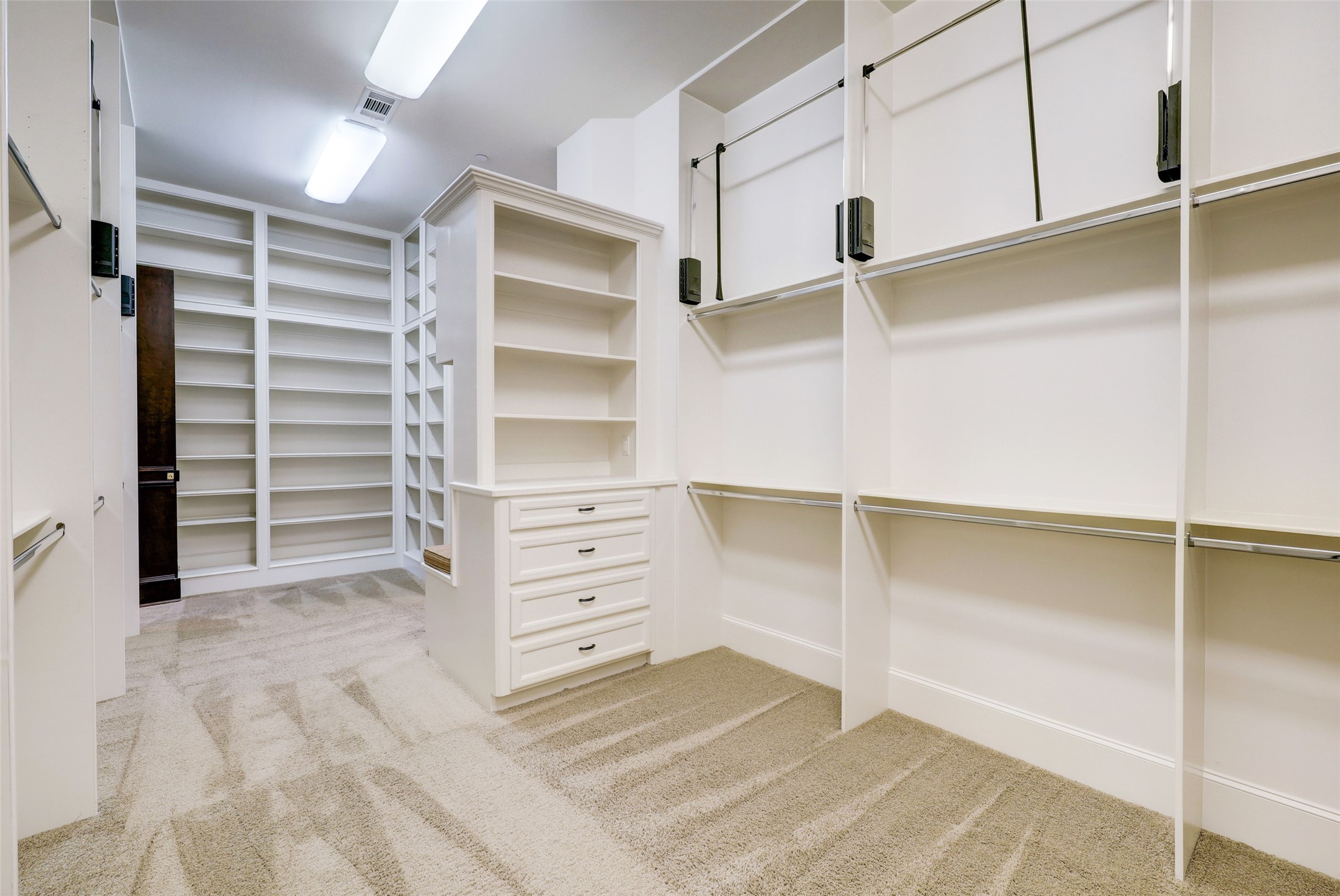 The Master Closet has most every type of storage you might fancy--dual Dressers; copious amounts of hanging space, including pull down racks; and shoe and purse storage. You name it, you can store it here!
