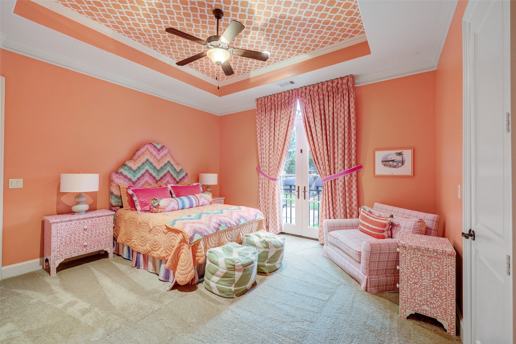 Guest Suite Three is awash in vivid colors and patterns. This Suite also features a cove ceiling, crown moulding, a walk in closet AND French doors that open to a Juliet balcony that overlooks the driveway--a perfect spot for your 