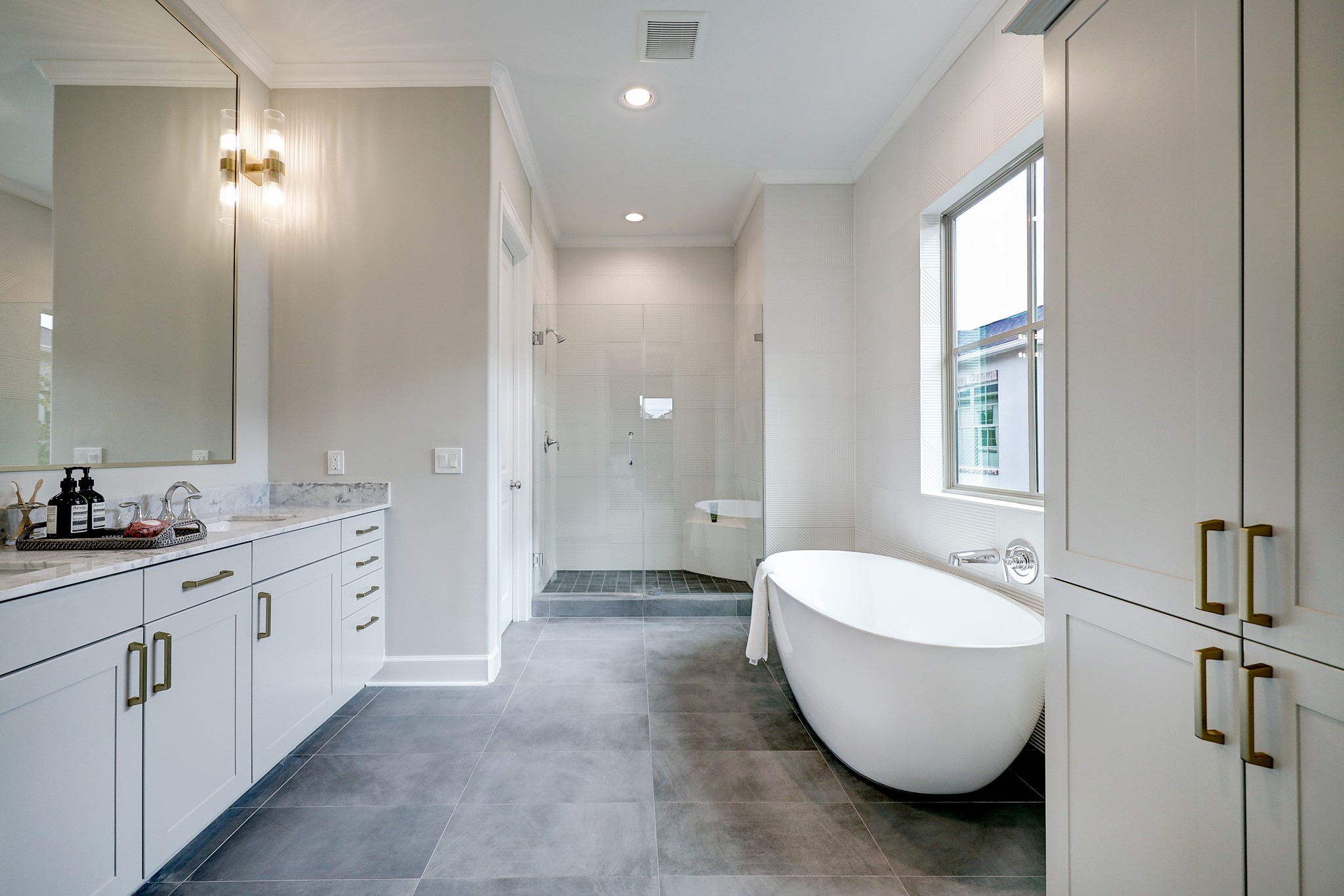 Primary bath features a soaking tub, walk in shower, double sinks and water closet.