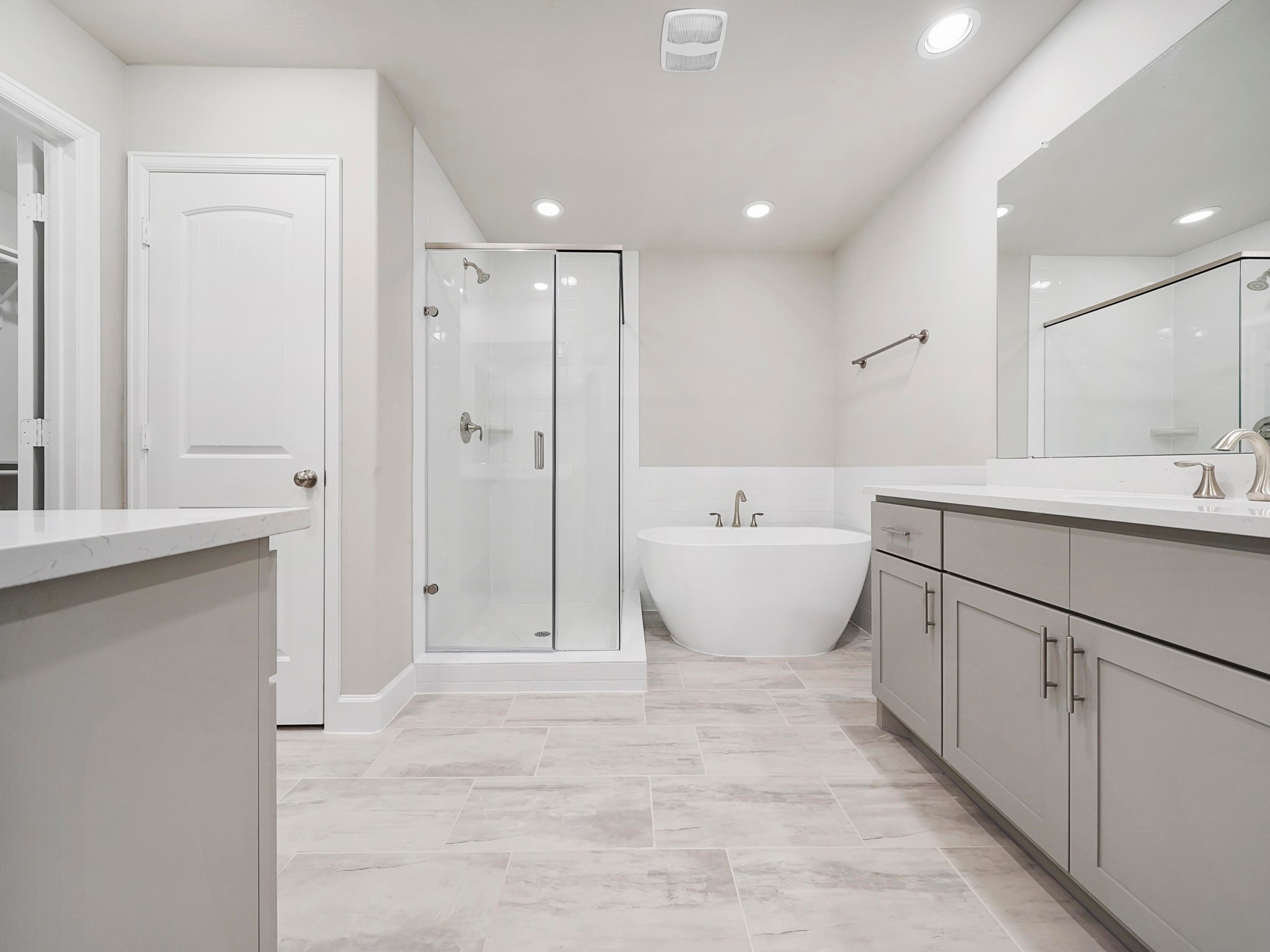 The Primary Bath  (Sample photos of a completed Bordeaux floor plan. The image may feature alternative selections and/or upgrades.)
