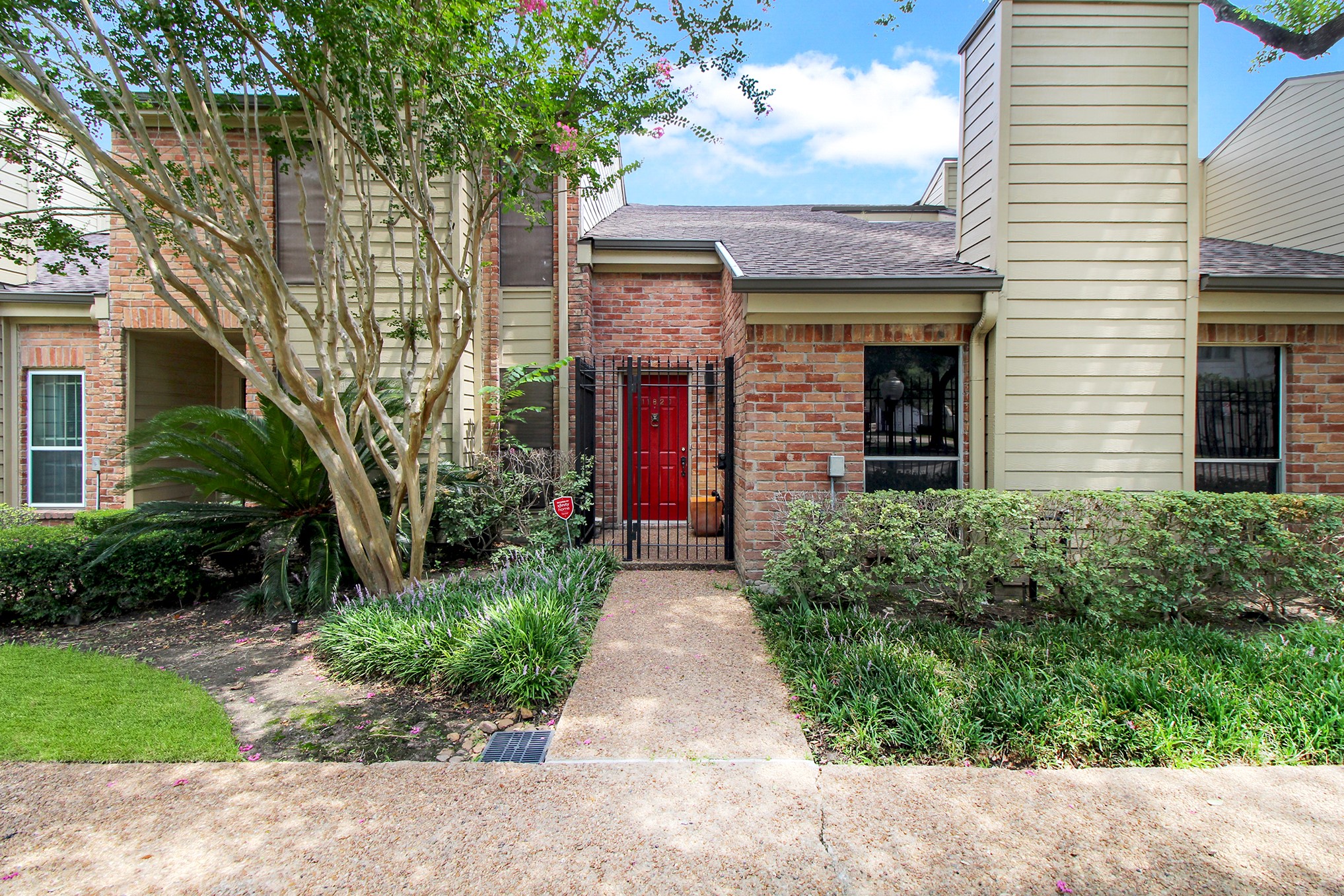 Welcome Home! 11820 Berryknoll Ln! Amazing home. Welcoming Red front door with a court yard.  Automatic gate when entering and 2 car garage for you to park in. This is a well planned Gated Complex with Town Homes.