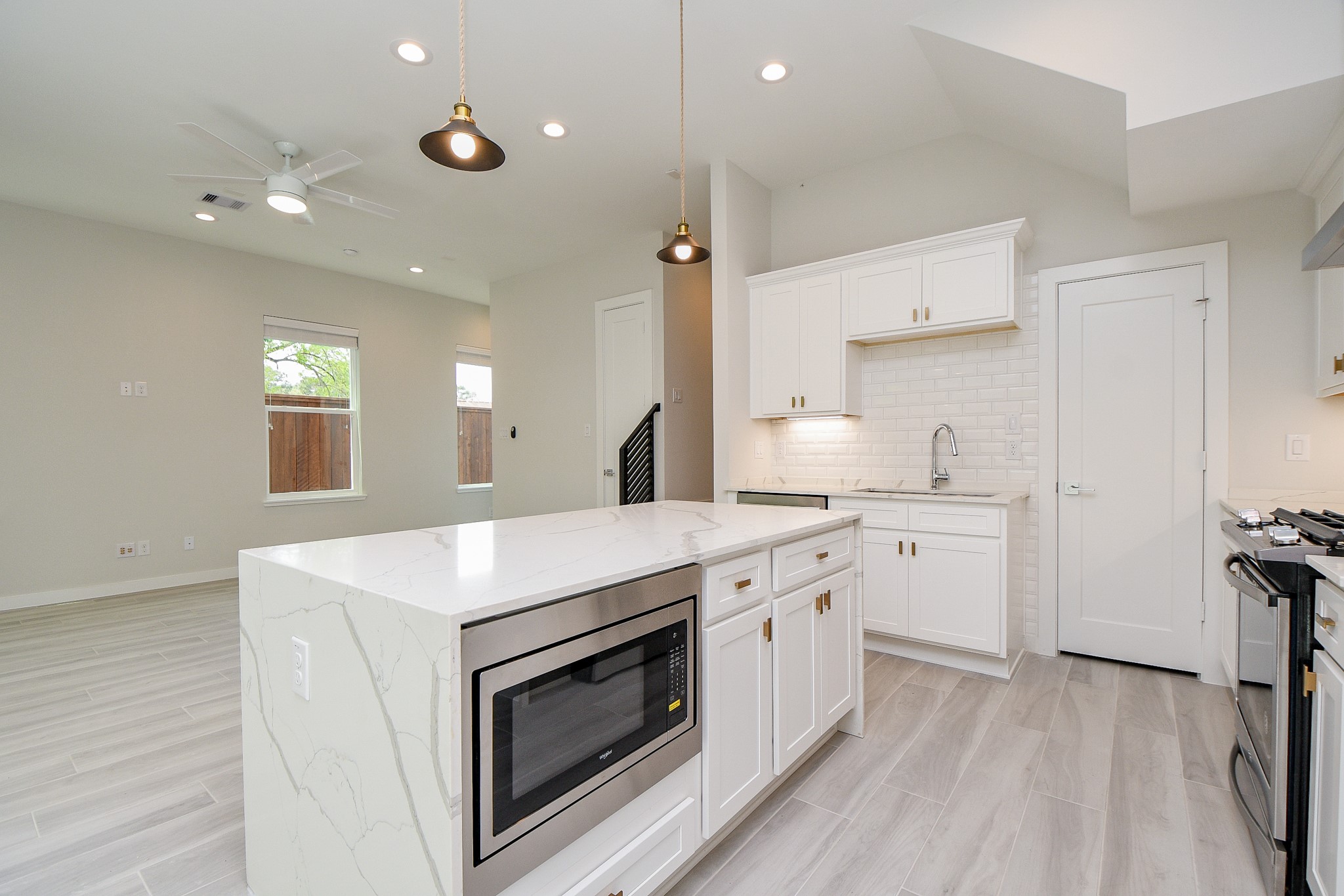 Kitchen to have same cabinets, finishes, and waterfall island as this recently completed home by same developer*