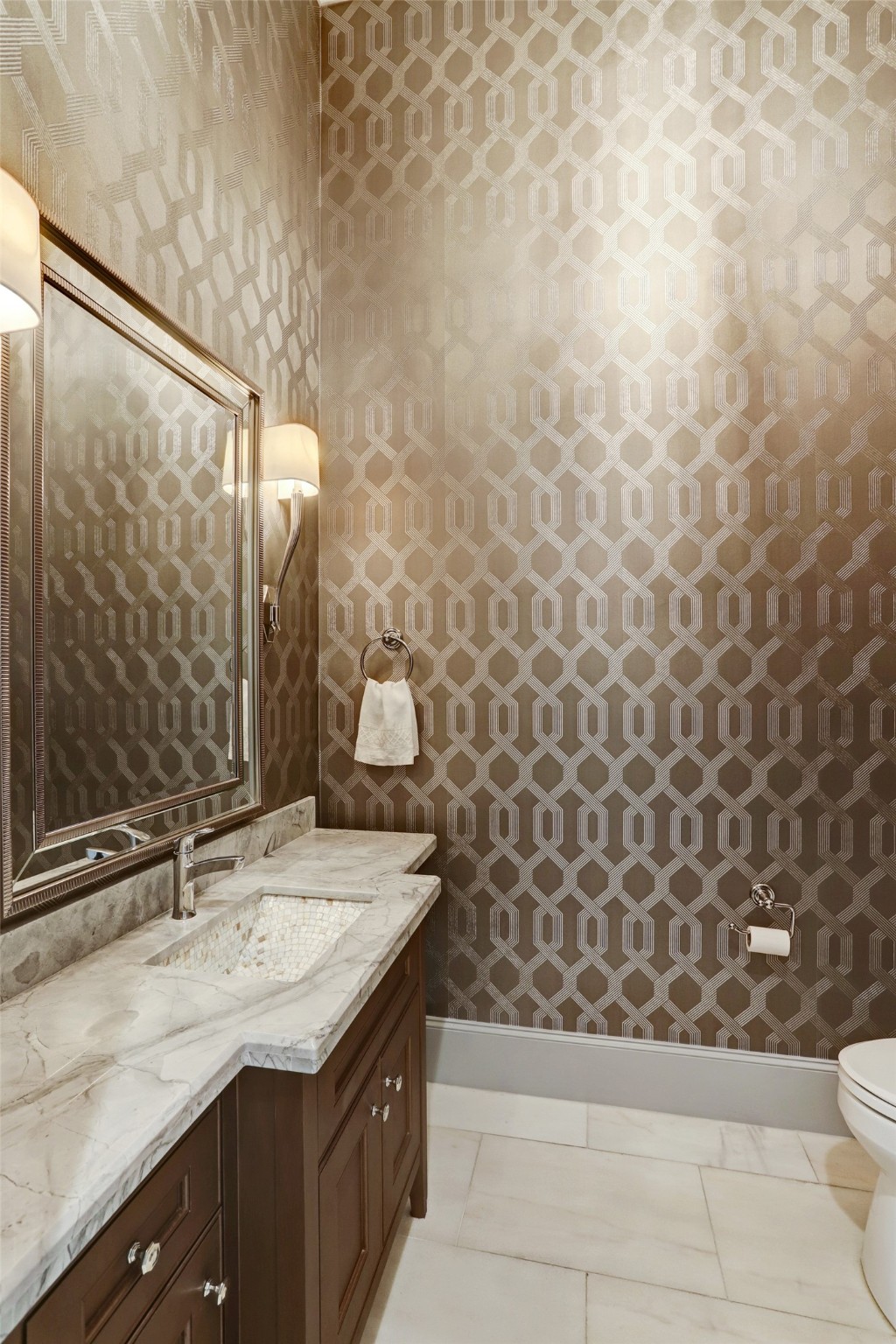 Luxurious powder room off the entry