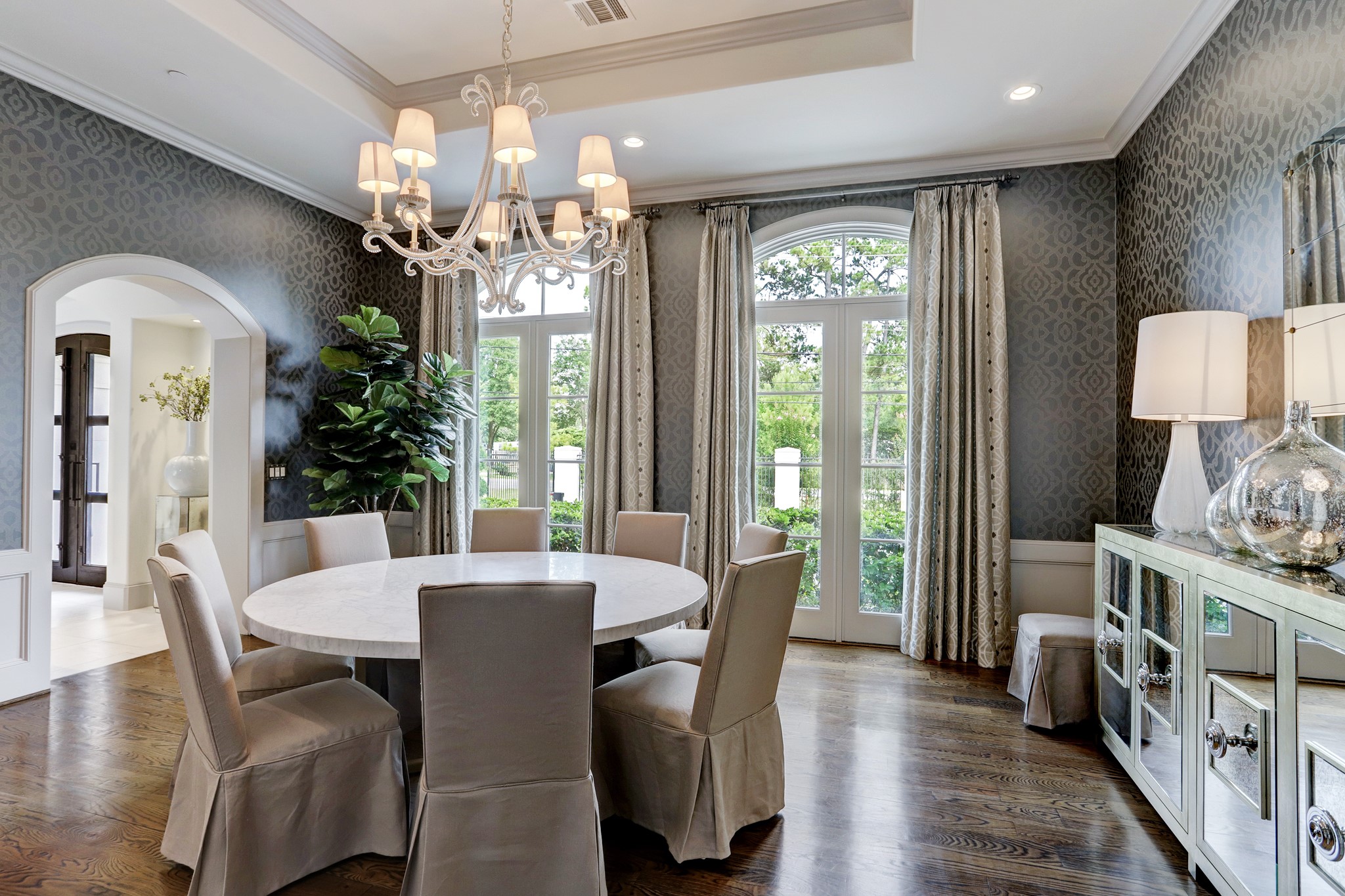 Large dining with beautiful chandelier and lighting