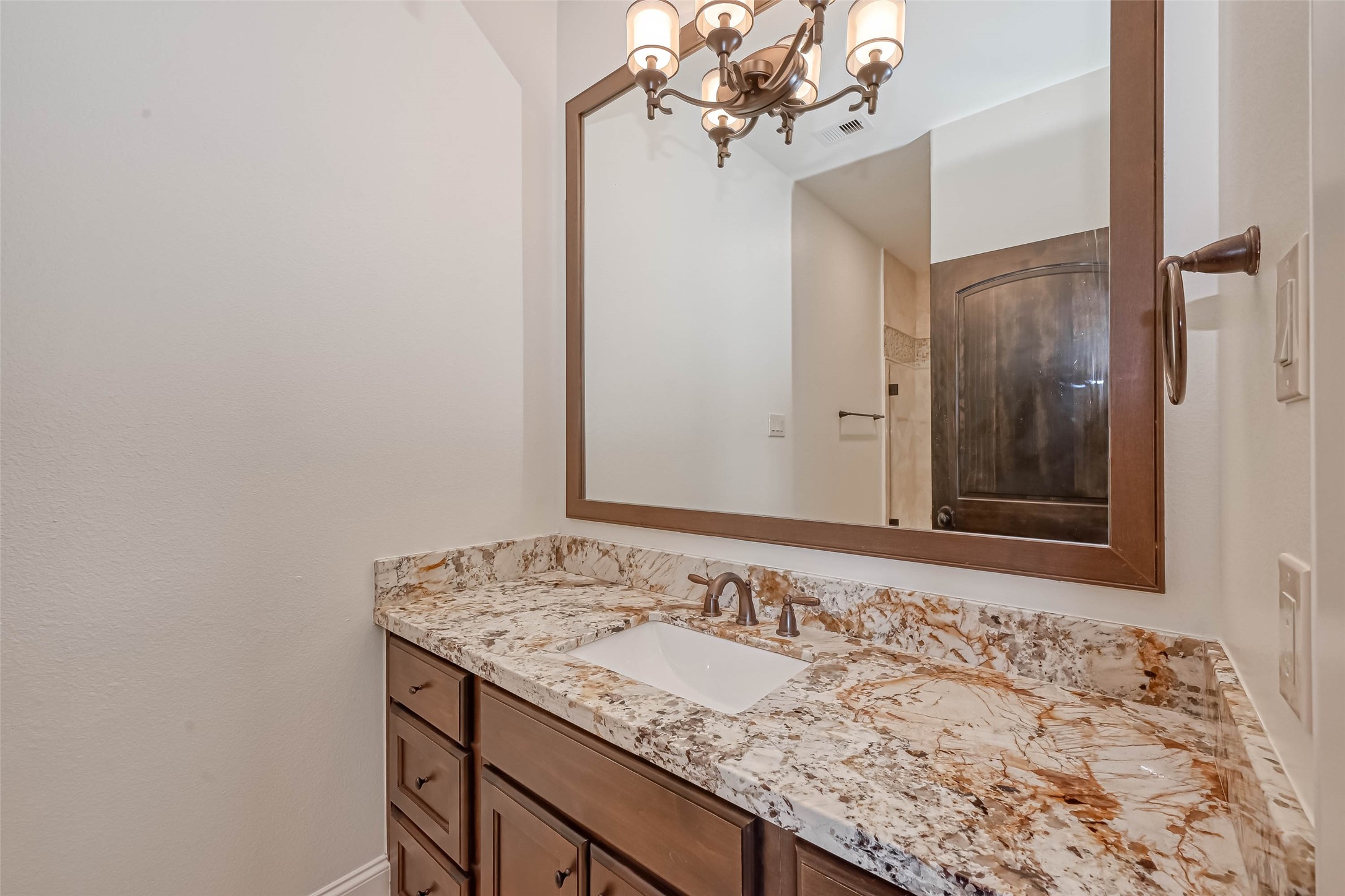 Vanity in the 2nd bathroom with granite counters