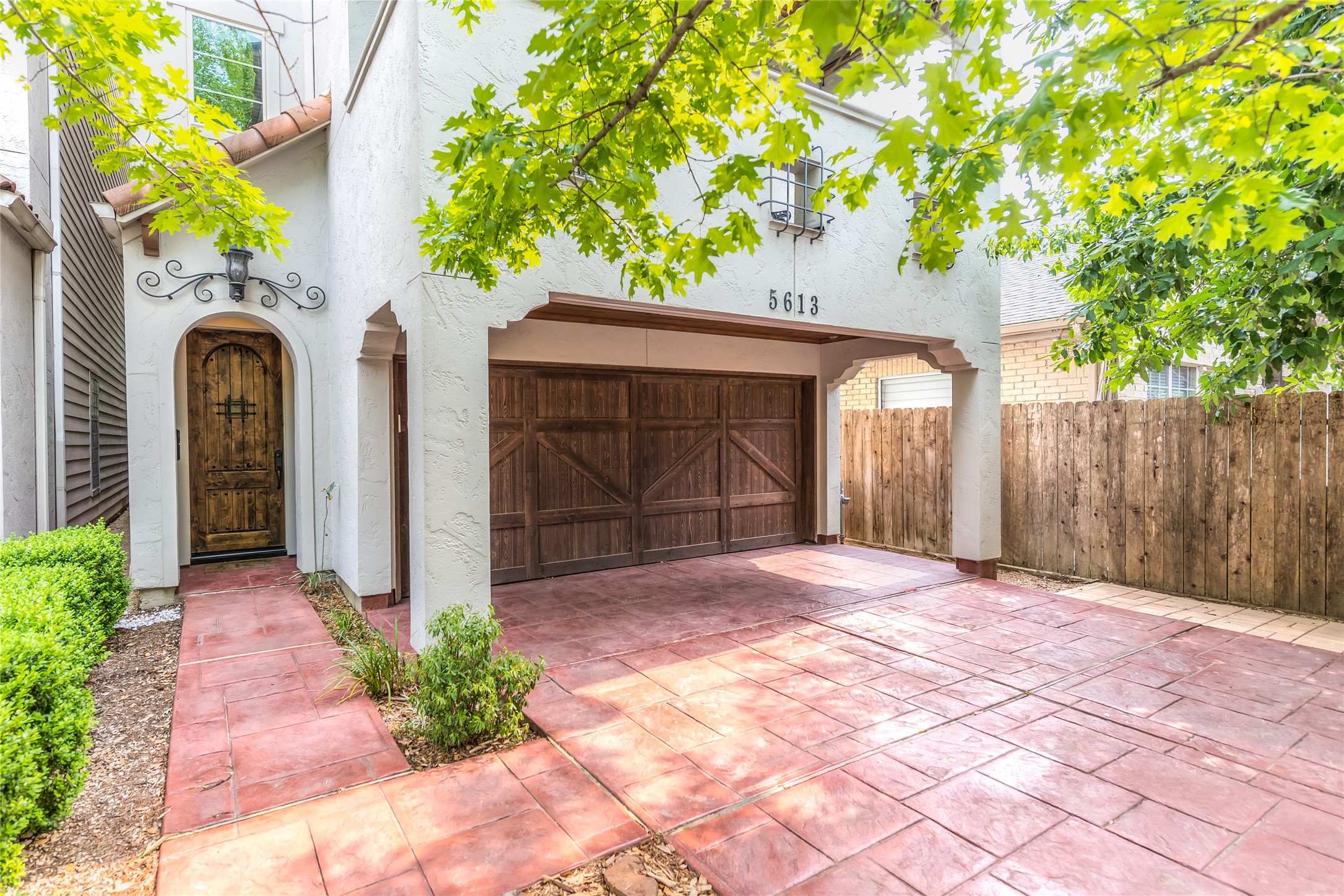 Terrific mediterranean patio home nestled along a quite, tree lined street in the sought after neighborhood of Rice Military.