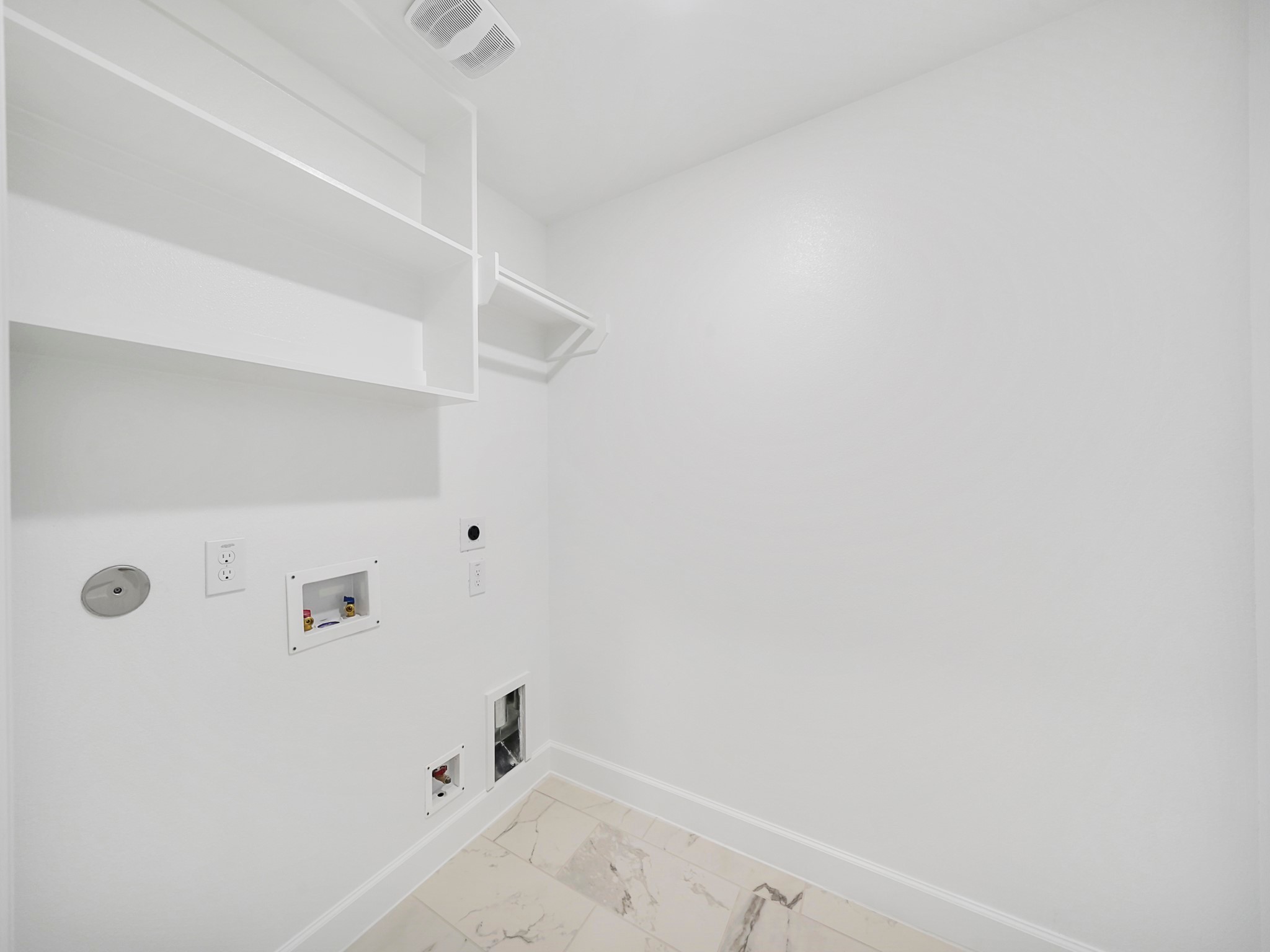 The Utility Room is located on the second floor, and features built-in shelves for additional storage. (Sample photos of a completed Bordeaux floor plan. The image may feature alternative selections and/or upgrades.)
