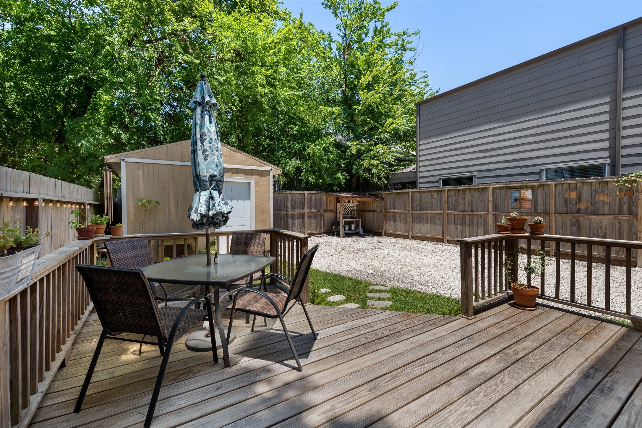Just off the kitchen is the back patio featuring a wood deck !