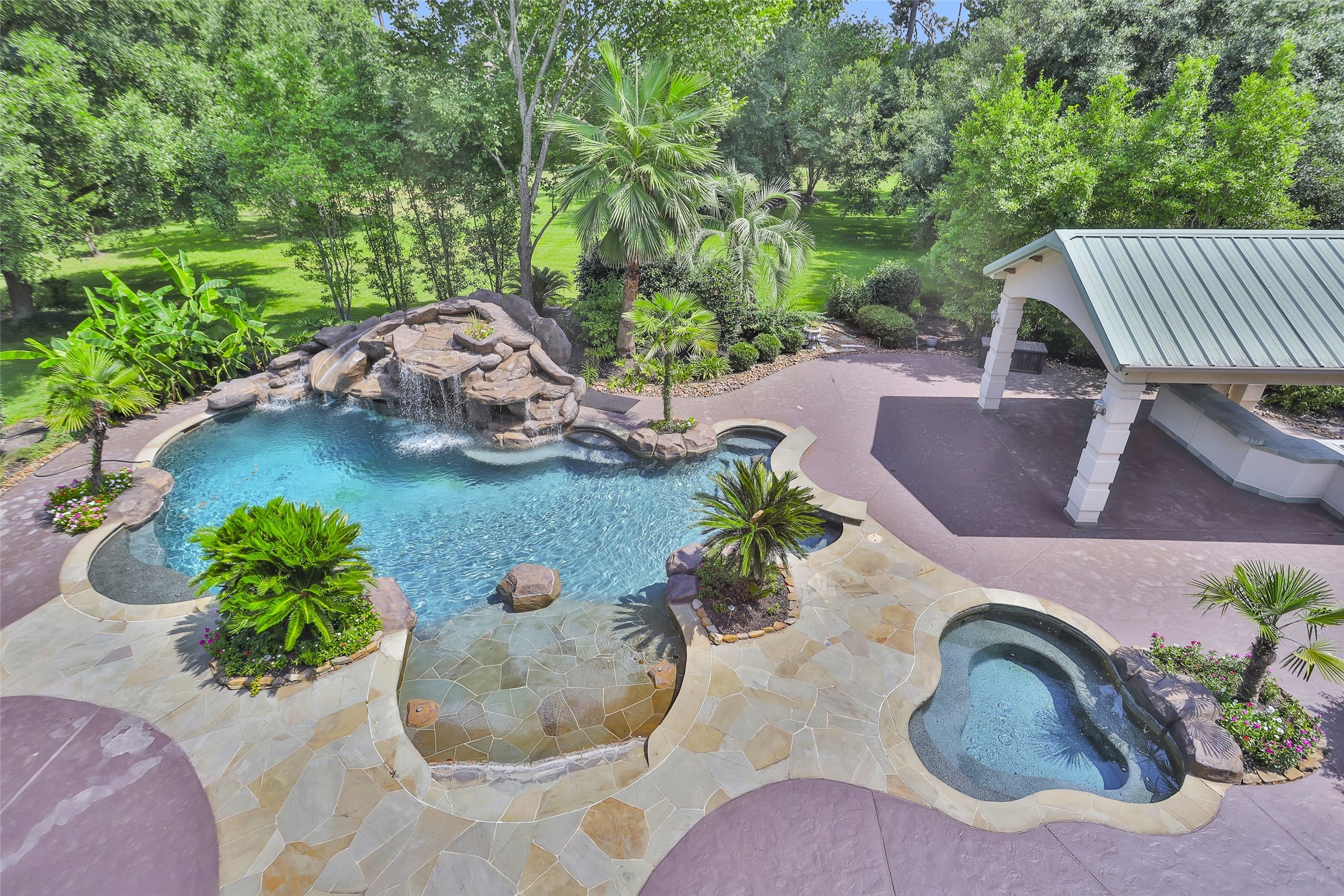 Ultra private Classic Italian style pool home on wooded 1.89-acres cul-de-sac in gated enclave of estate homes w/ private fishing lakes, walking trails & lakeside gazebos.