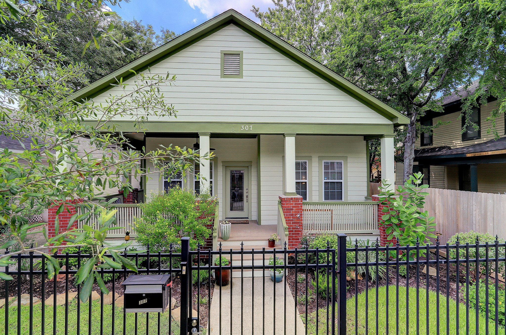 This Montrose gem makes a great first impression with its wrought-iron gate, well-manicured and landscaped front yard and its charming exterior façade.