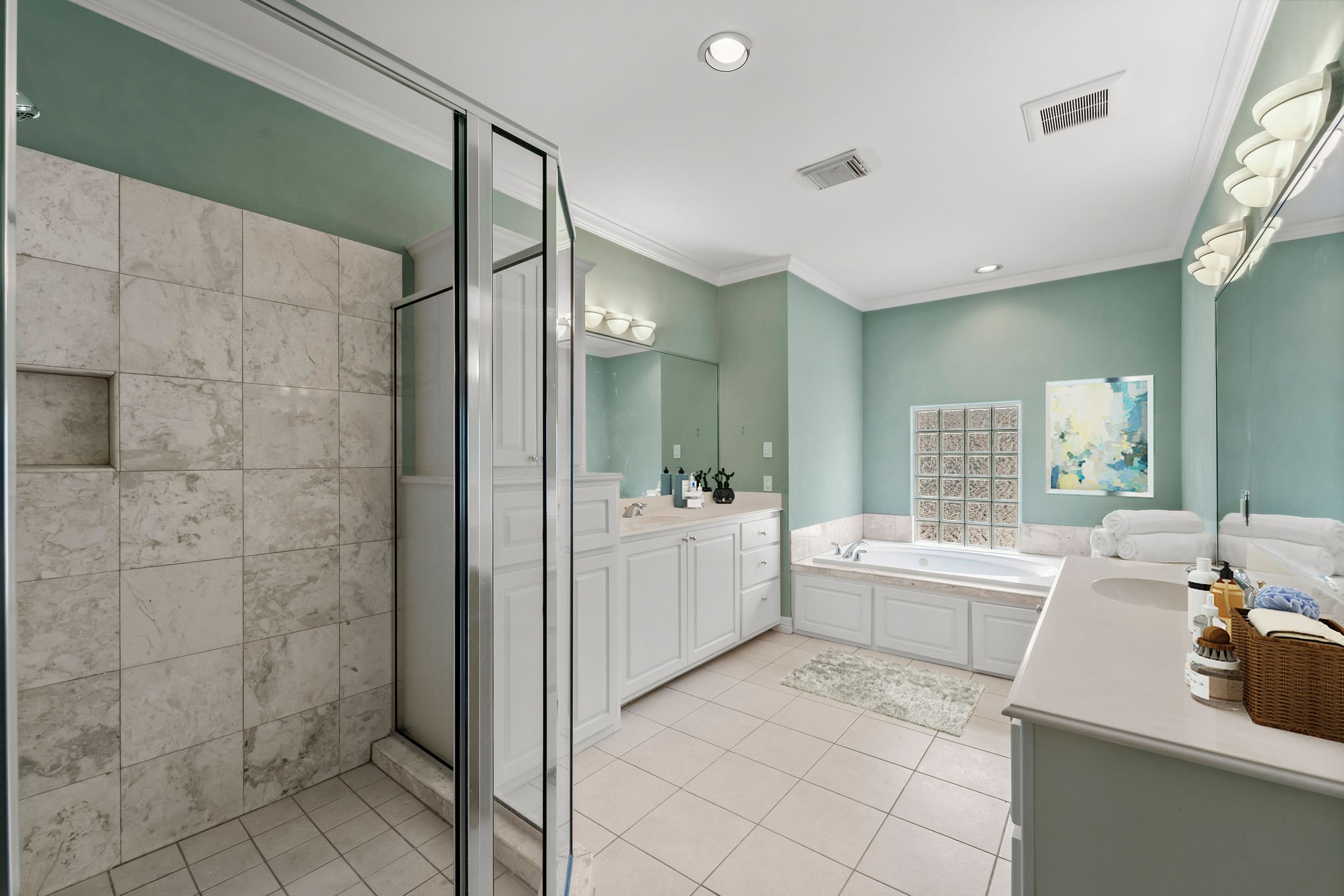 Great layout in this Primary Bath with double vanities, separate shower and jetted tub.
