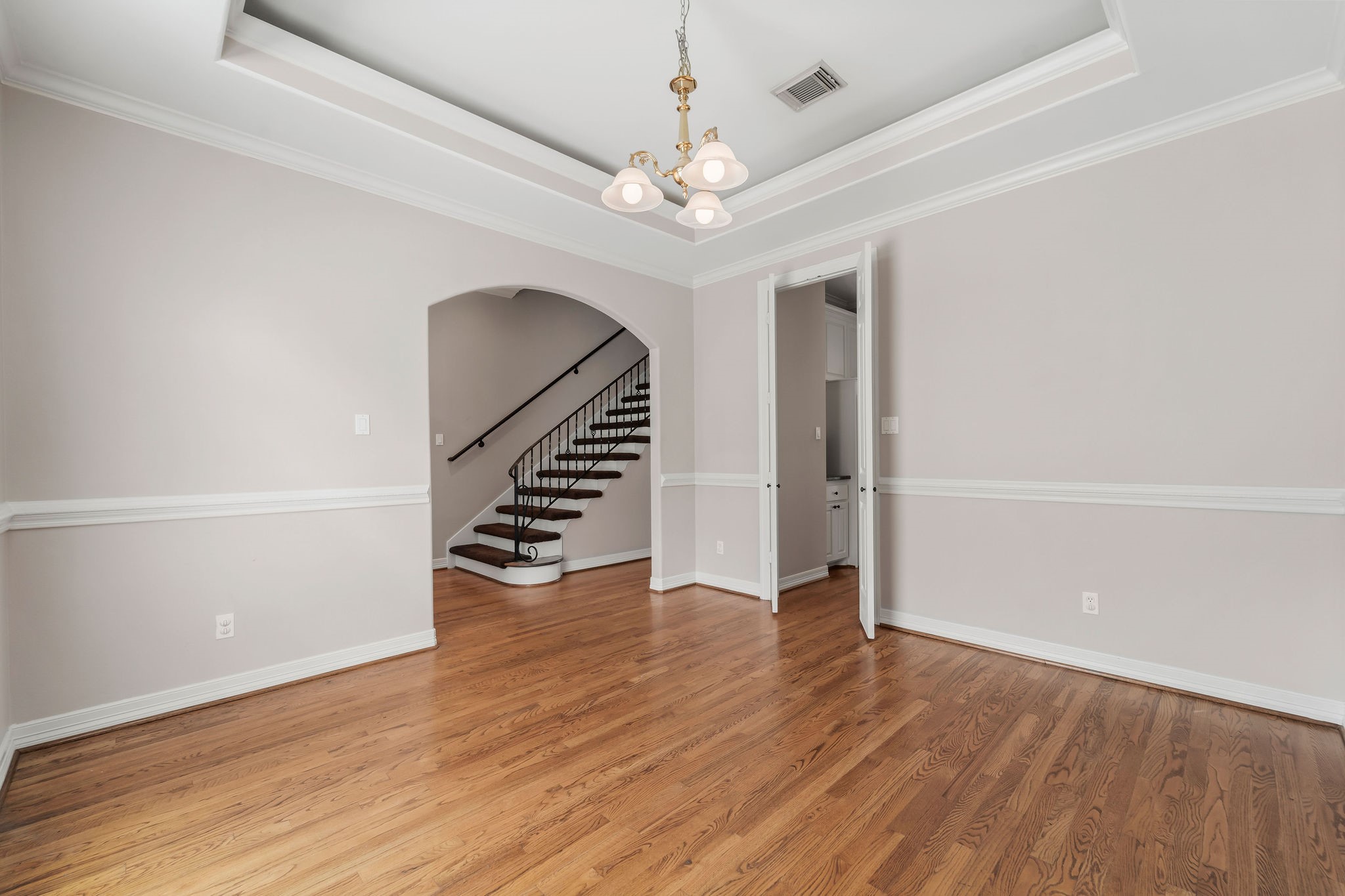 Alternate view of dining room. Located in the front of the house, can also be a home office, study or game room.Beautiful hardwood floors. Crown moulding. High ceilings.