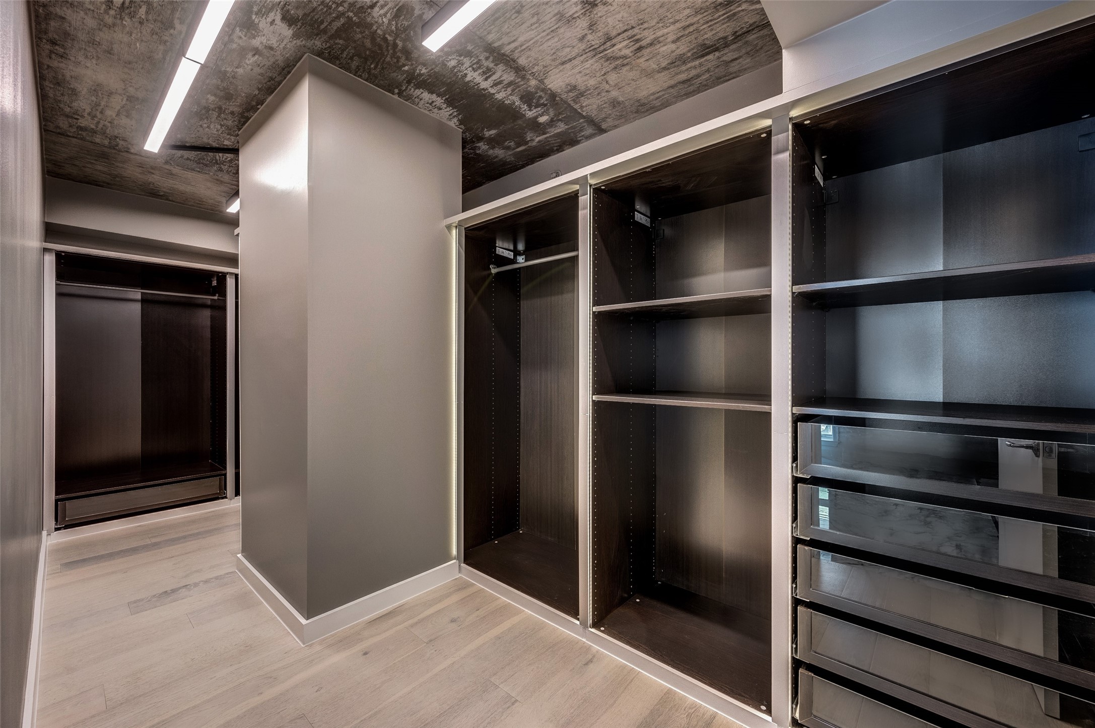 Designer closet similar to your favorite store. All customized with LED encasement lighting.