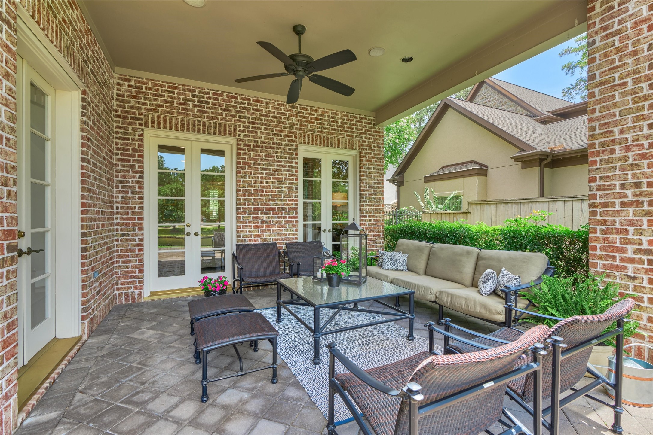 Perfect place to gather with friends on the large back covered patio with ceiling fan.