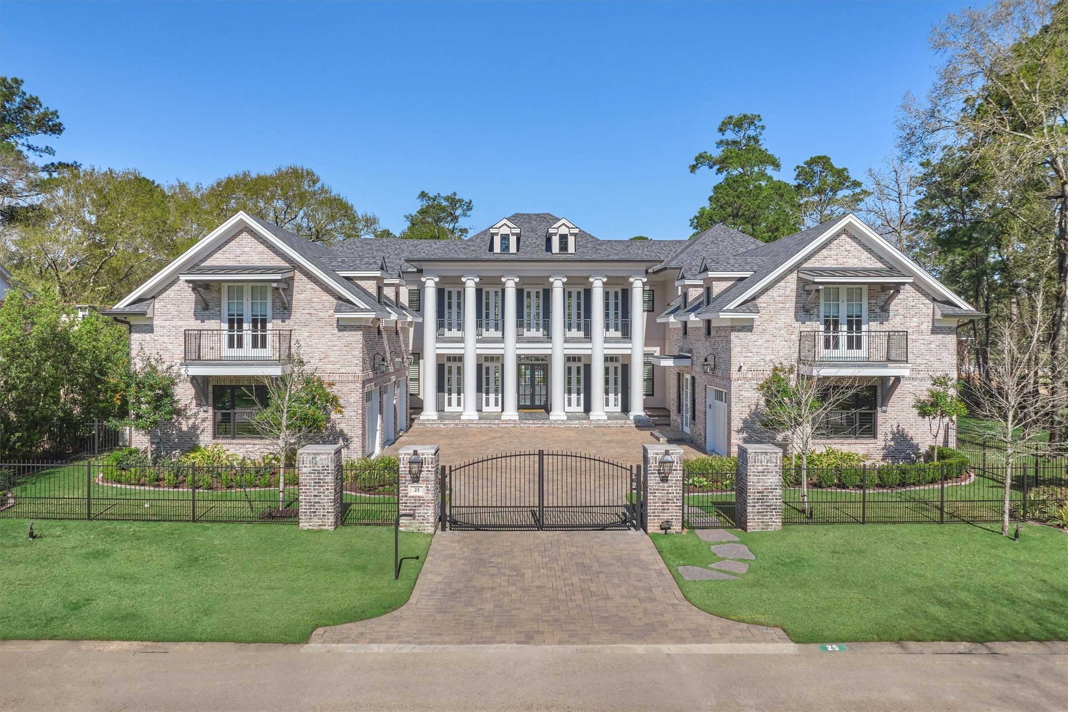 This distinctive Southern Colonial estate offers elegant and traditional finishes.