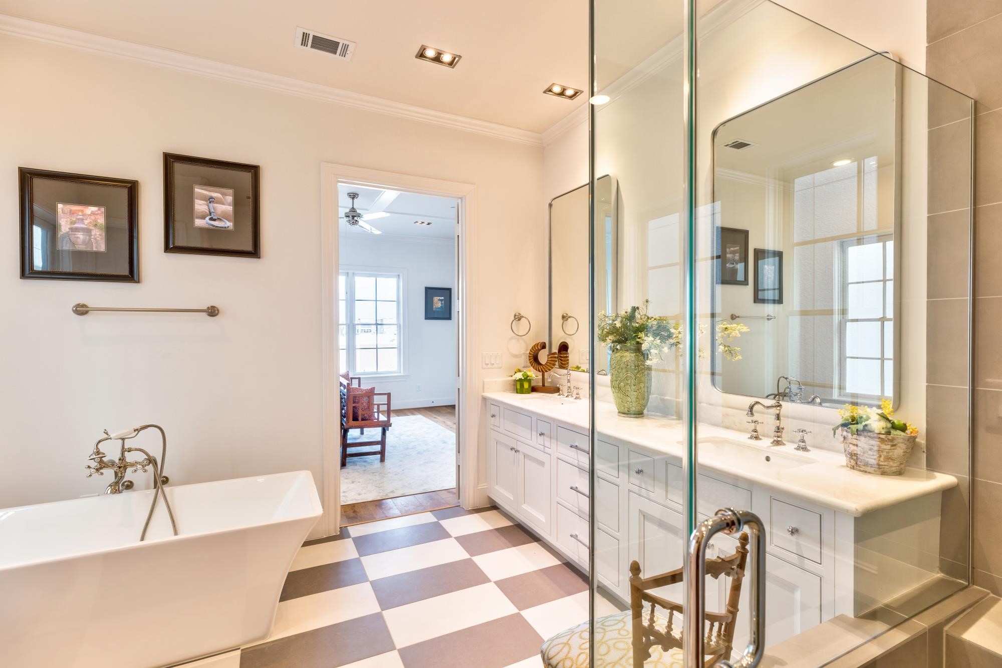 Personalize your en-suite primary bath with luxurious Rohl plumbing fixtures and chic marble floors.