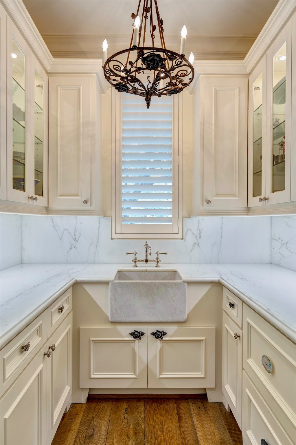 Butler's pantry off kitchen and dining with marble counters and sink with great storage
