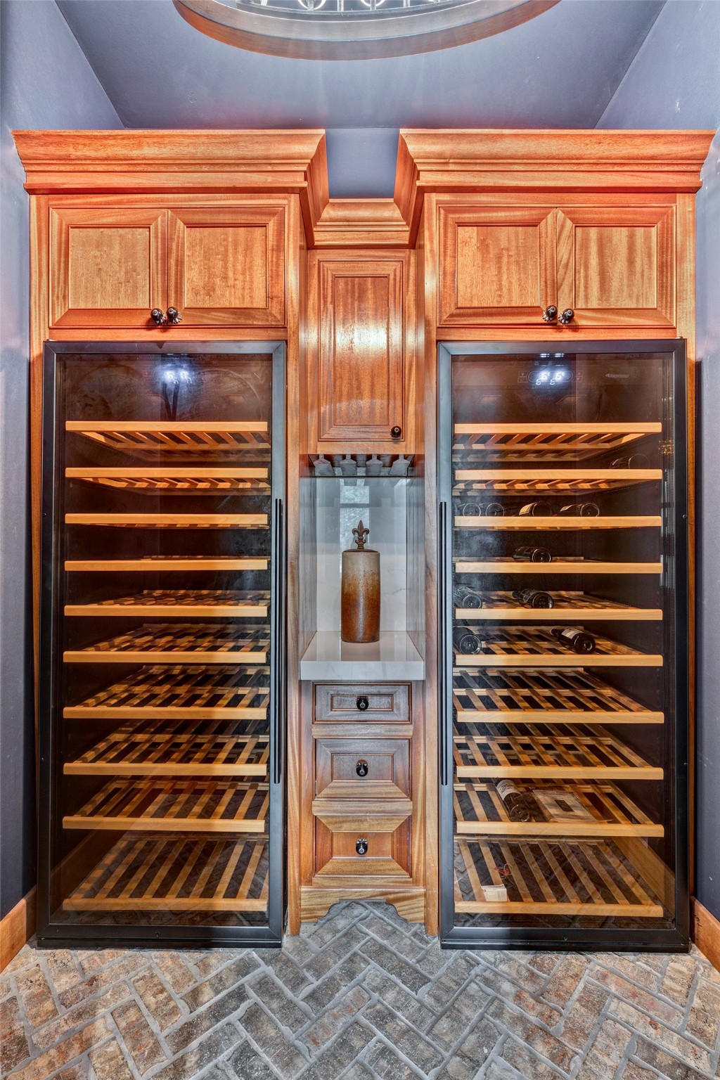 Wine room off formal study with two full size wine refrigerators.