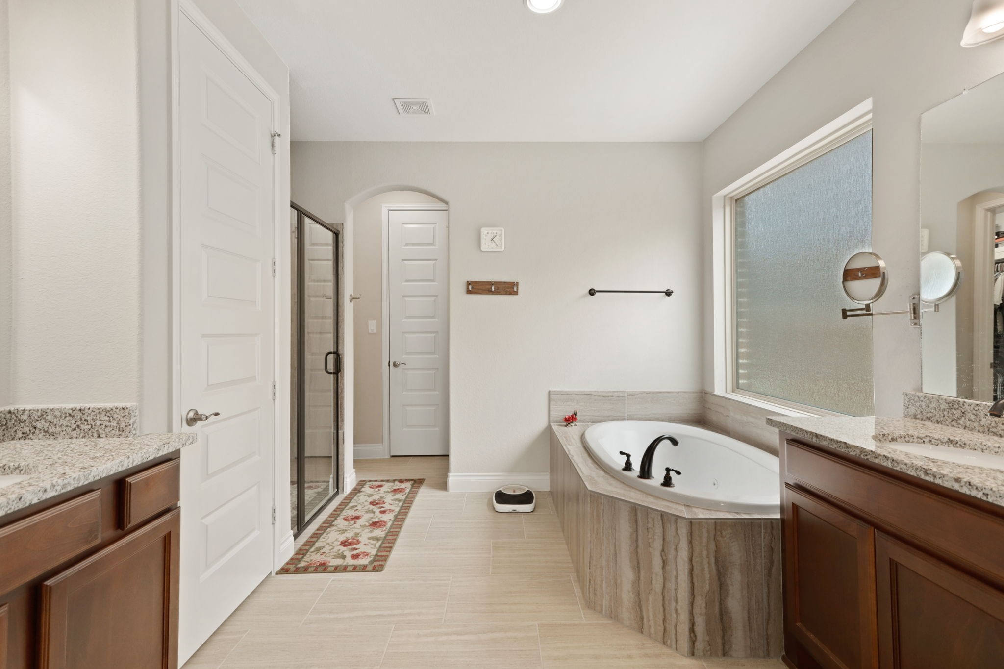 Primary bath with tub and standing shower.