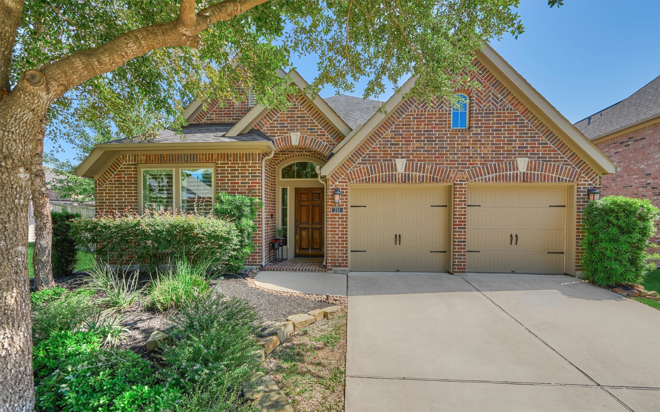 This one story home is beautiful from the curb to back yard! The brick exterior and carriage style garage doors give a custom look to this luxurious ONE STORY home!